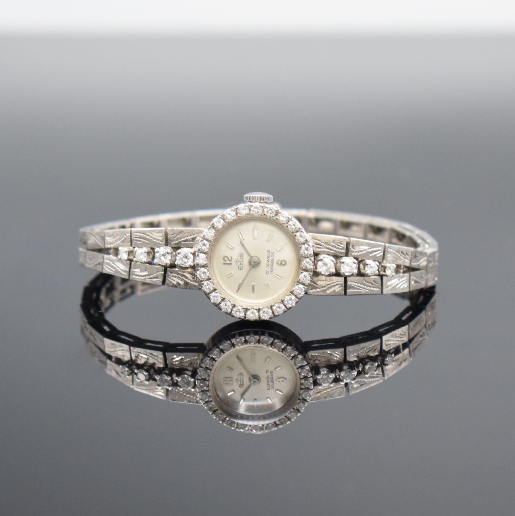 ERBE Damengoldbanduhr in WG 750/000 mit Diamantbesatz, Schweiz um 1960, Handaufzug, WG 750/000 Band, Boden aufgedr., silb. Zifferbl. m. silb. Ind. & ...