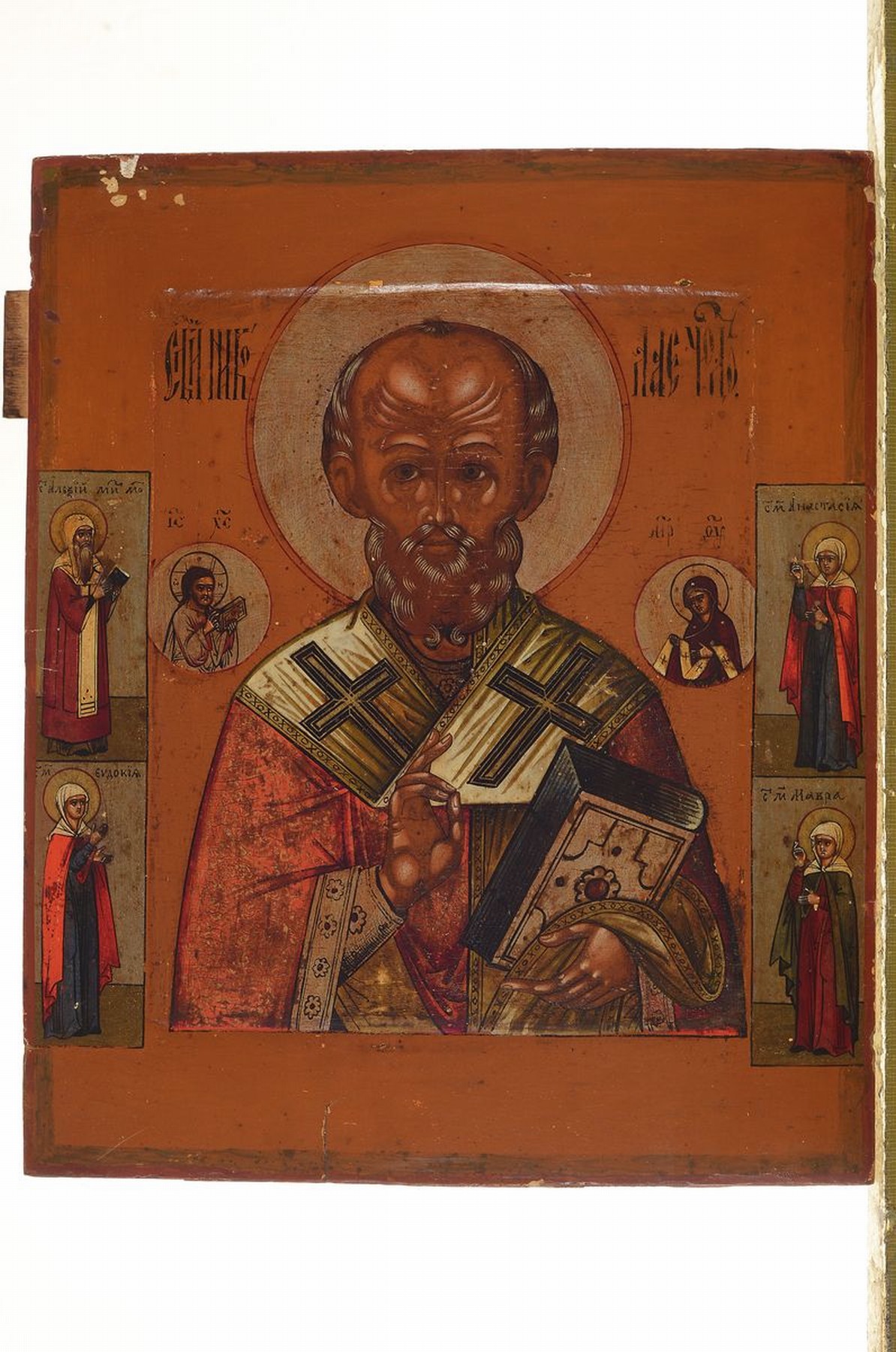 Detail k: Ikone, Russland, um 1900, Hl. Nikolaus, Tempera auf Holz, vertieftes Mittelfeld, vier Randheilige, ca. 31x25cm, leichtere Oberflächenschäden