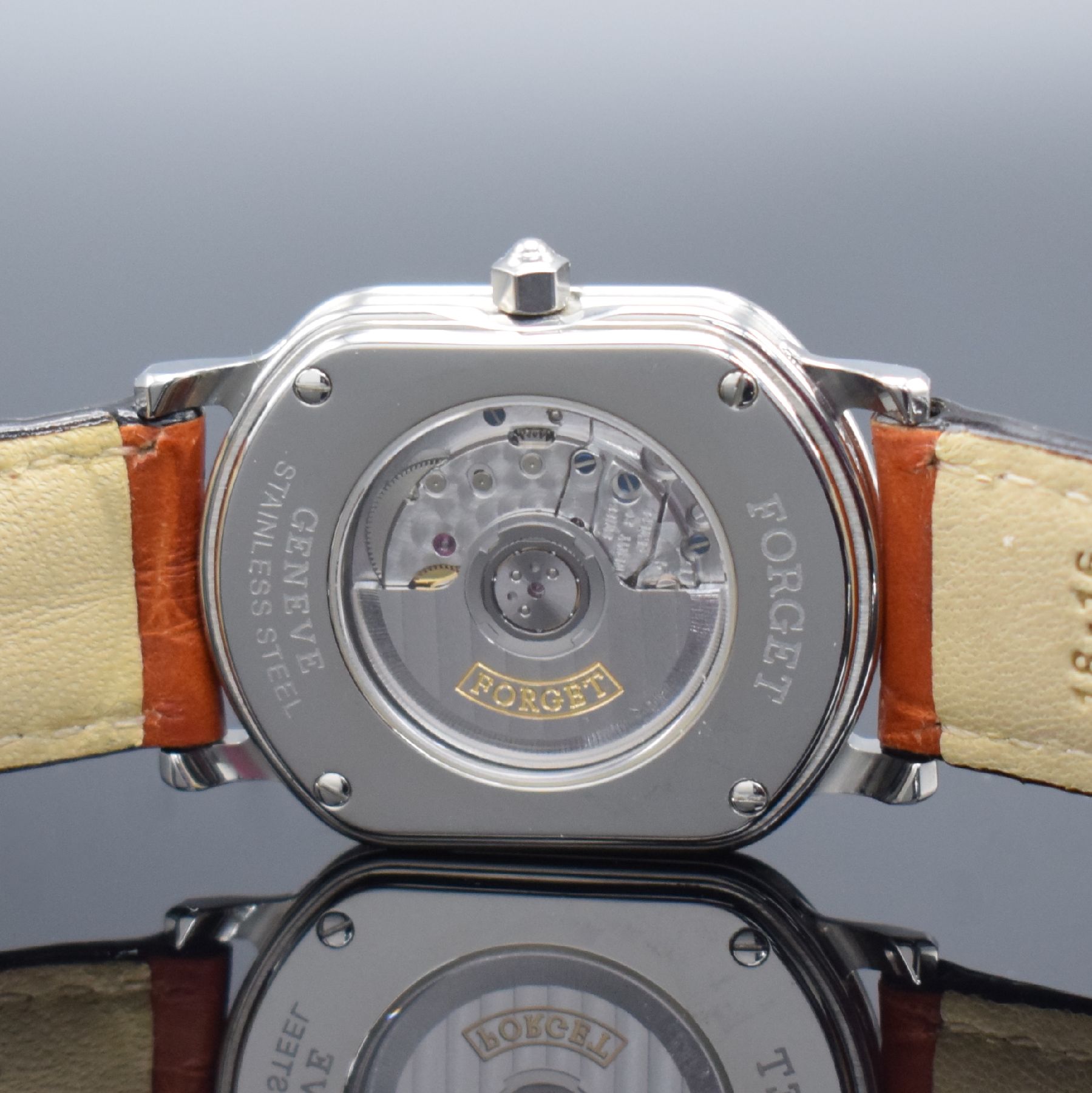 Detail d: FORGET ungetragene Armbanduhr in Edelstahl, Schweiz um 1990, Automatik, aufwendiges, rechteck. & beids. vergl. Geh., Boden 4-fach verschr., weißes, ...