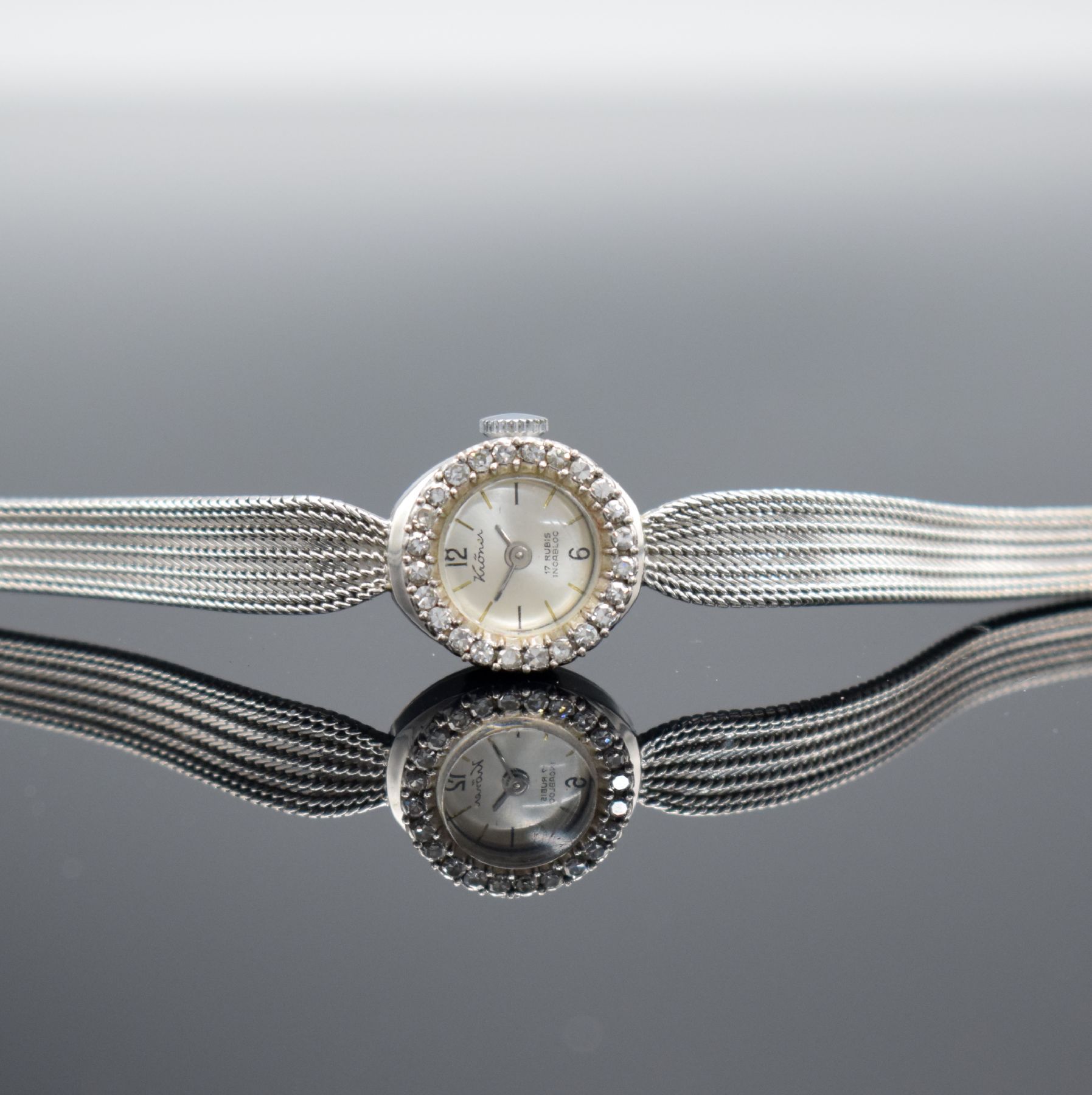 KRÖNER Damenarmbanduhr in WG 585/000, um 1960, Handaufzug, 2-teil. Geh., Boden aufgedr., WG 585/000 Milanaiseband, Lünette mit Diamanten bes., ...