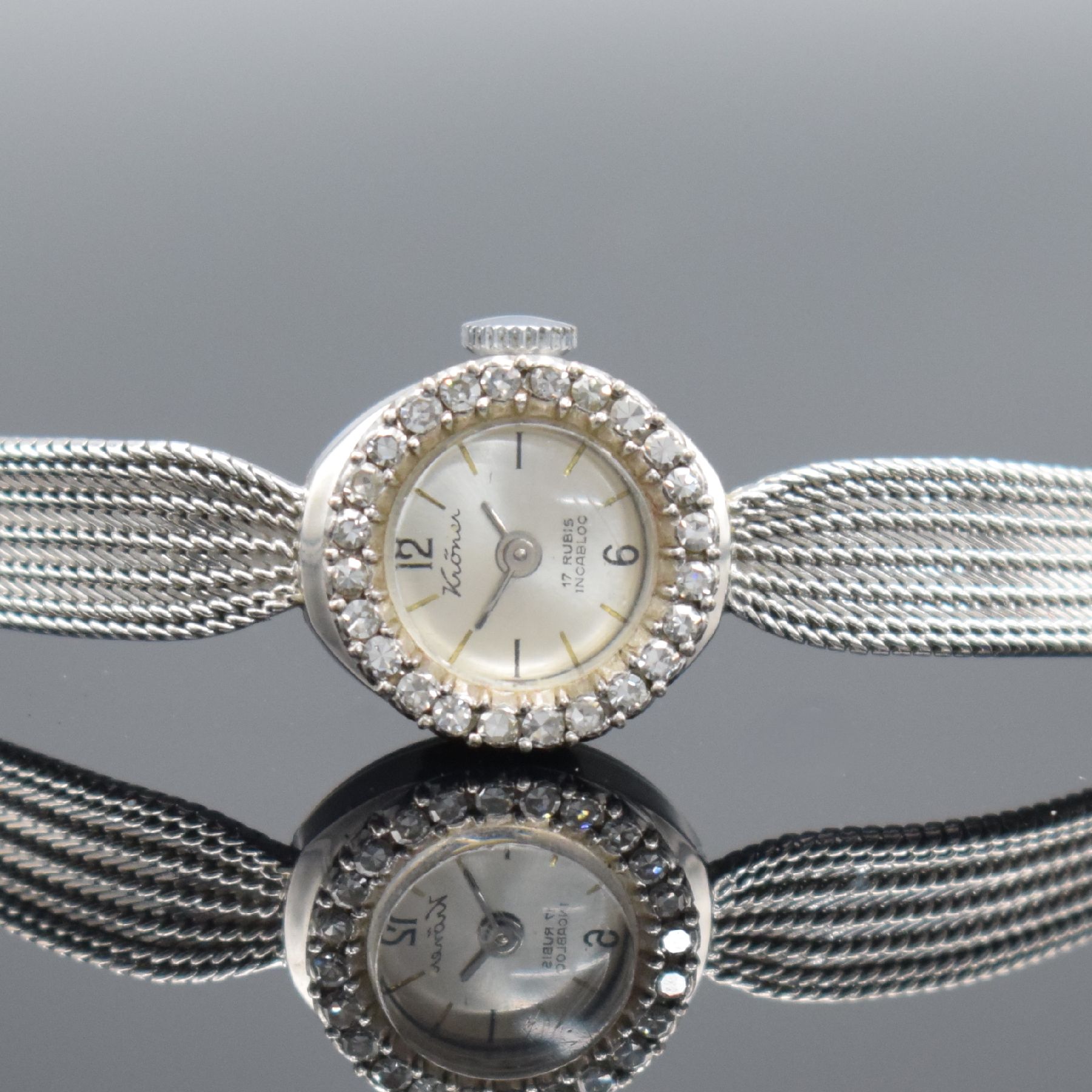 Detail a: KRÖNER Damenarmbanduhr in WG 585/000, um 1960, Handaufzug, 2-teil. Geh., Boden aufgedr., WG 585/000 Milanaiseband, Lünette mit Diamanten bes., ...