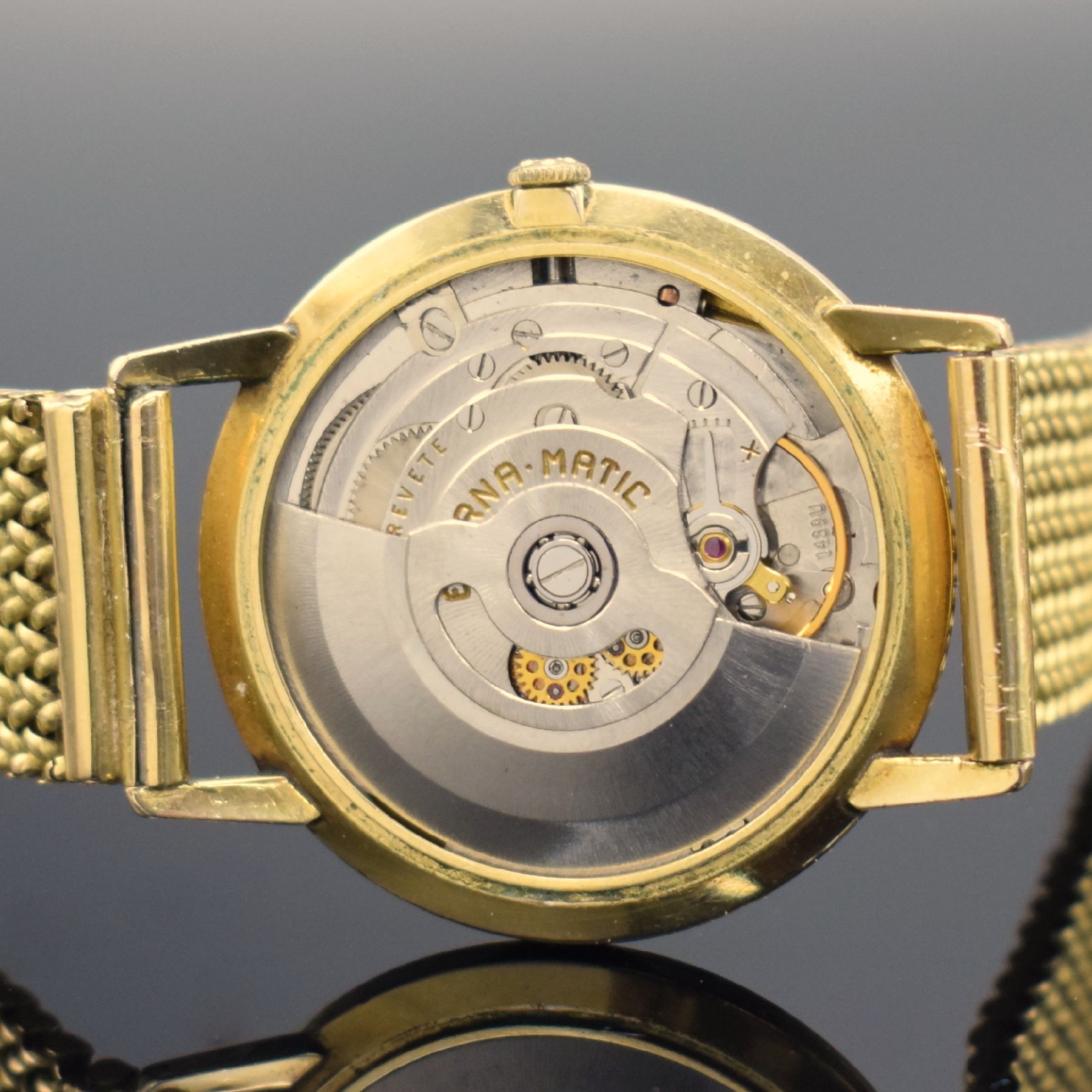 Detail e: ETERNA-MATIC Centenaire vergoldete Herrenarmbanduhr mit neutralem GG 750/000 Band, Schweiz um 1960, Automatik, 3-teil. Geh., Boden & Glasrand ...