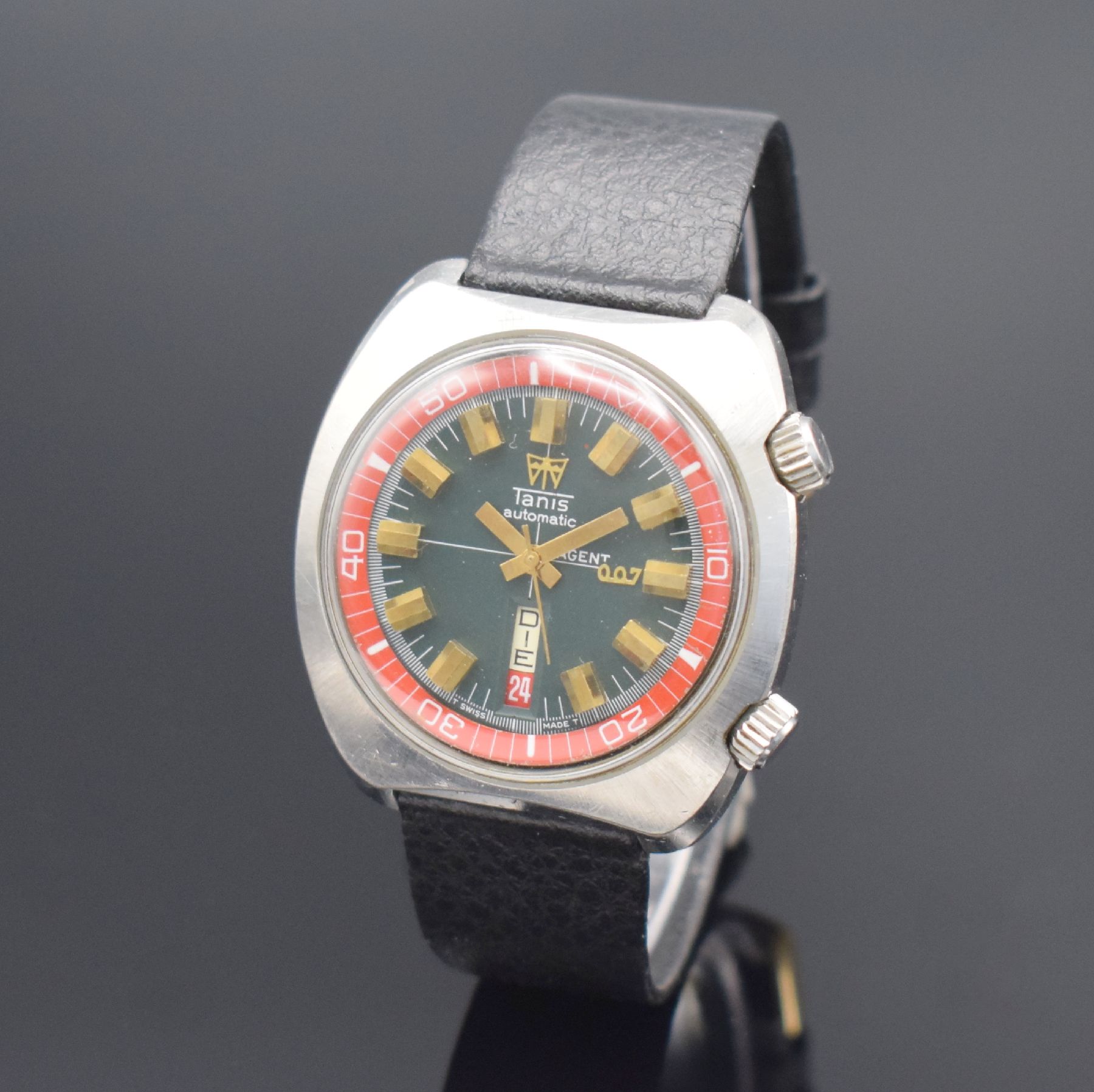 TANIS Herrenarmbanduhr mit seltenem Zifferblatt bezeichnet Agent 007, Schweiz um 1970, Automatik, Edelstahlgeh., Stahlboden verschr., dunkelgraues ...