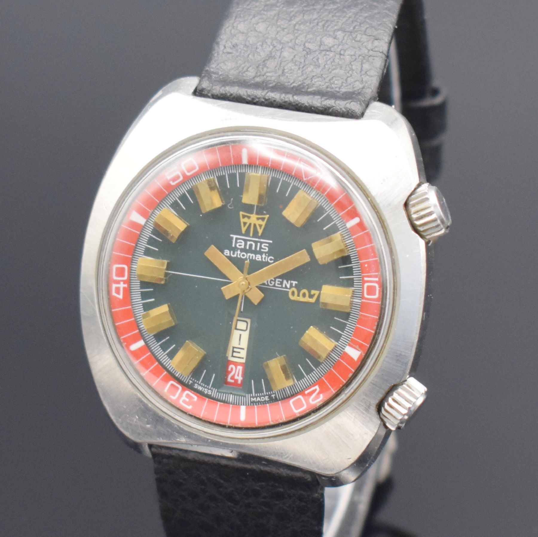 Detail a: TANIS Herrenarmbanduhr mit seltenem Zifferblatt bezeichnet Agent 007, Schweiz um 1970, Automatik, Edelstahlgeh., Stahlboden verschr., dunkelgraues ...