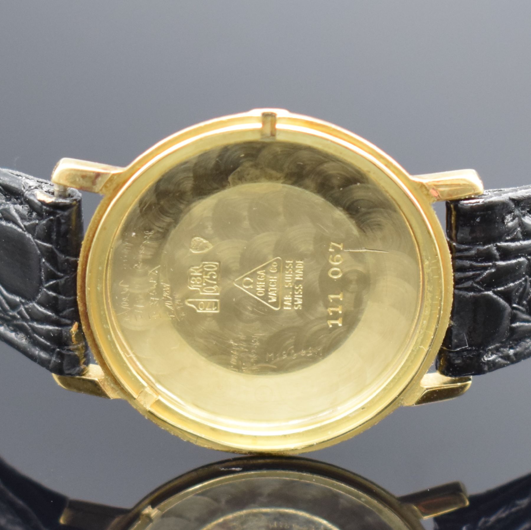 Detail c: OMEGA De Ville Herrenarmbanduhr in GG 750/000, Schweiz um 1969, Handaufzug, Ref. 111 067, 2-teil. Geh. angel., Glasrand aufgedr., gold. Zifferbl. m. ...