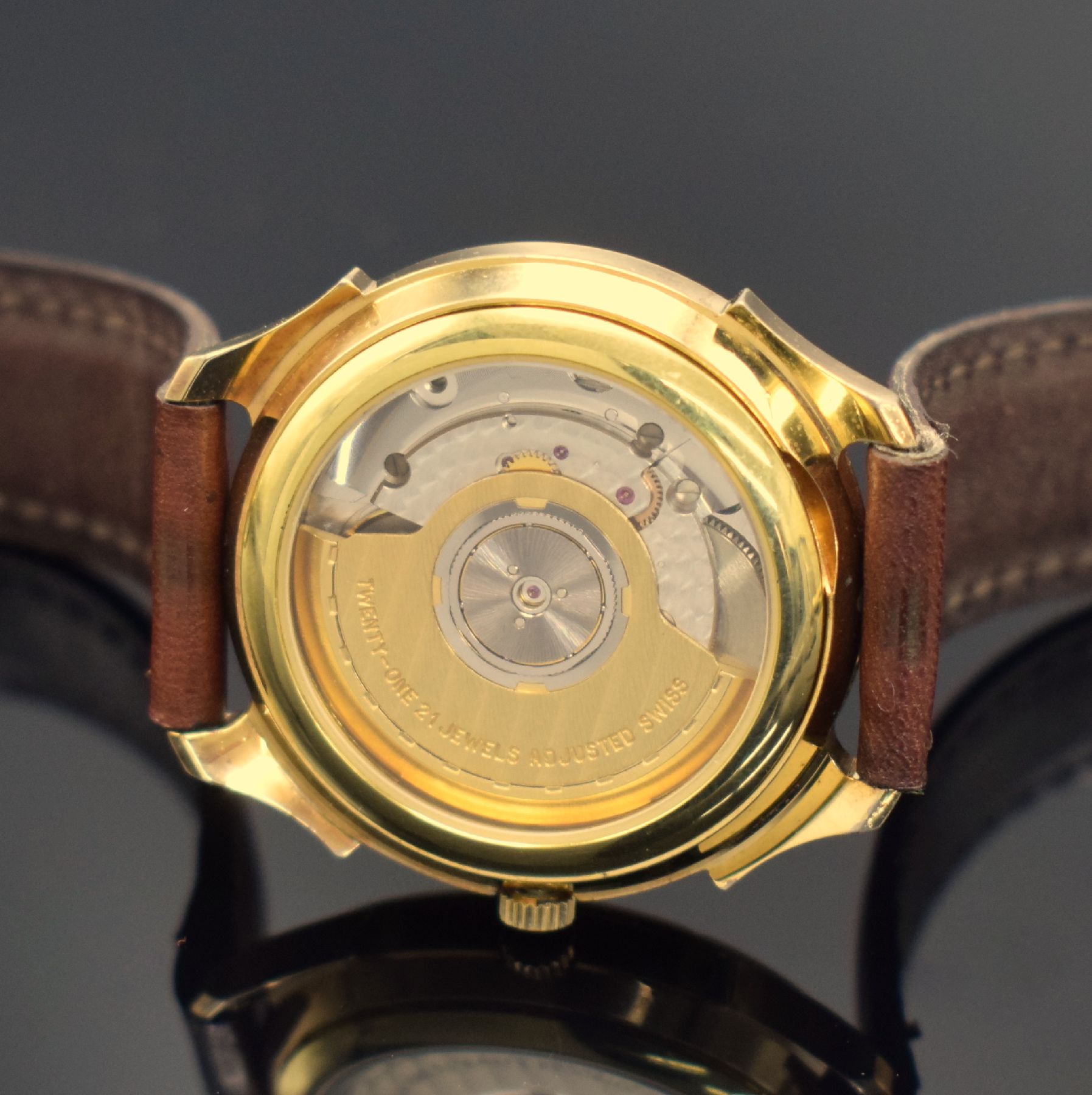 Detail d: GUB Glashütte/SA Herrenarmbanduhr, Deutschland, Automatik, beids. vergl., verg. Geh., Boden aufgedr., weißes Zifferbl. m. arab. Zahlen, gold. ...