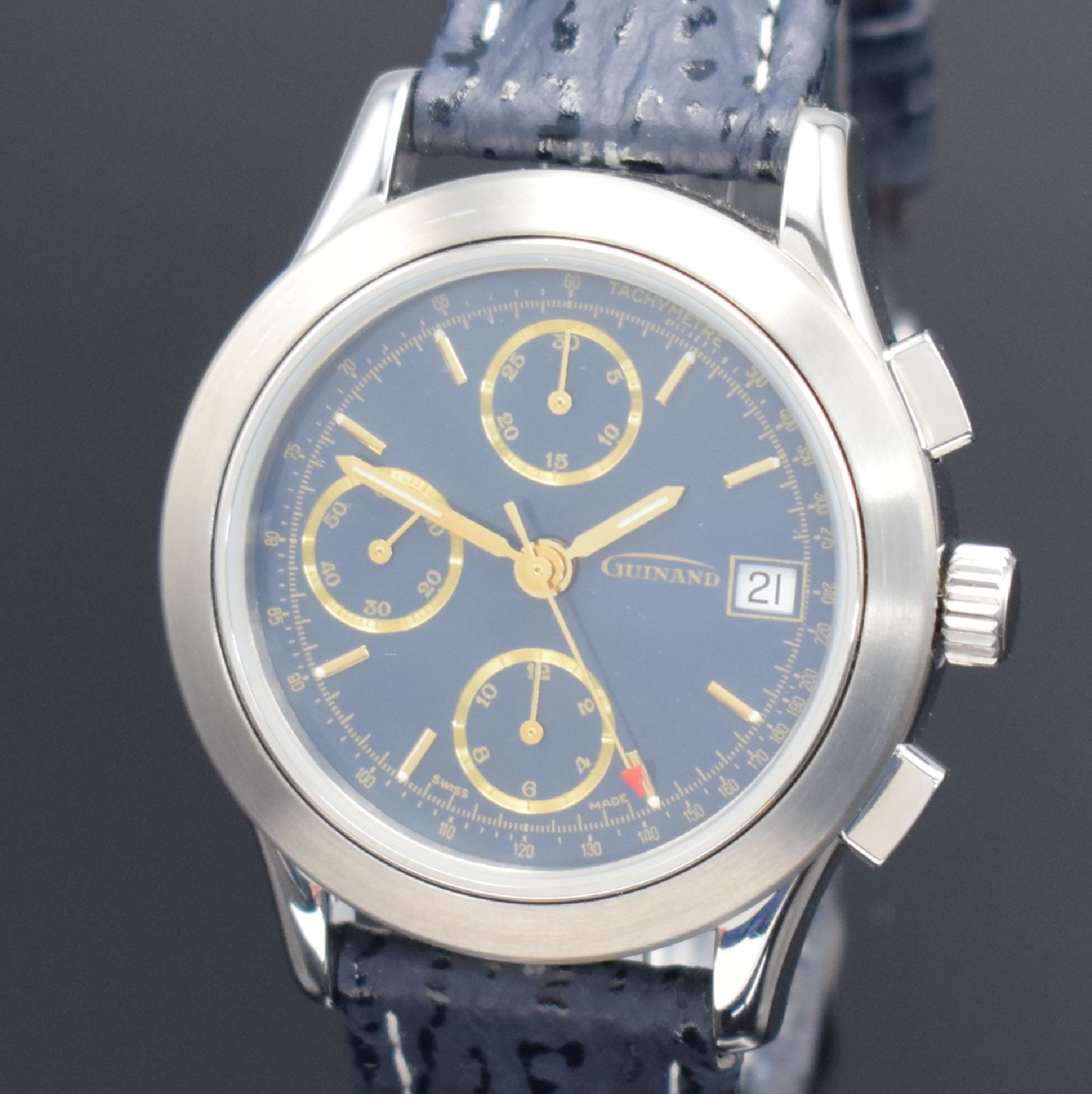 Detail a: GUINAND nahezu neuwertige Herrenarmbanduhr mit Chronograph, Schweiz um 2000, Automatik, verschr. Geh. in Edelstahl, blaues Zifferbl. m. aufges. gold. ...