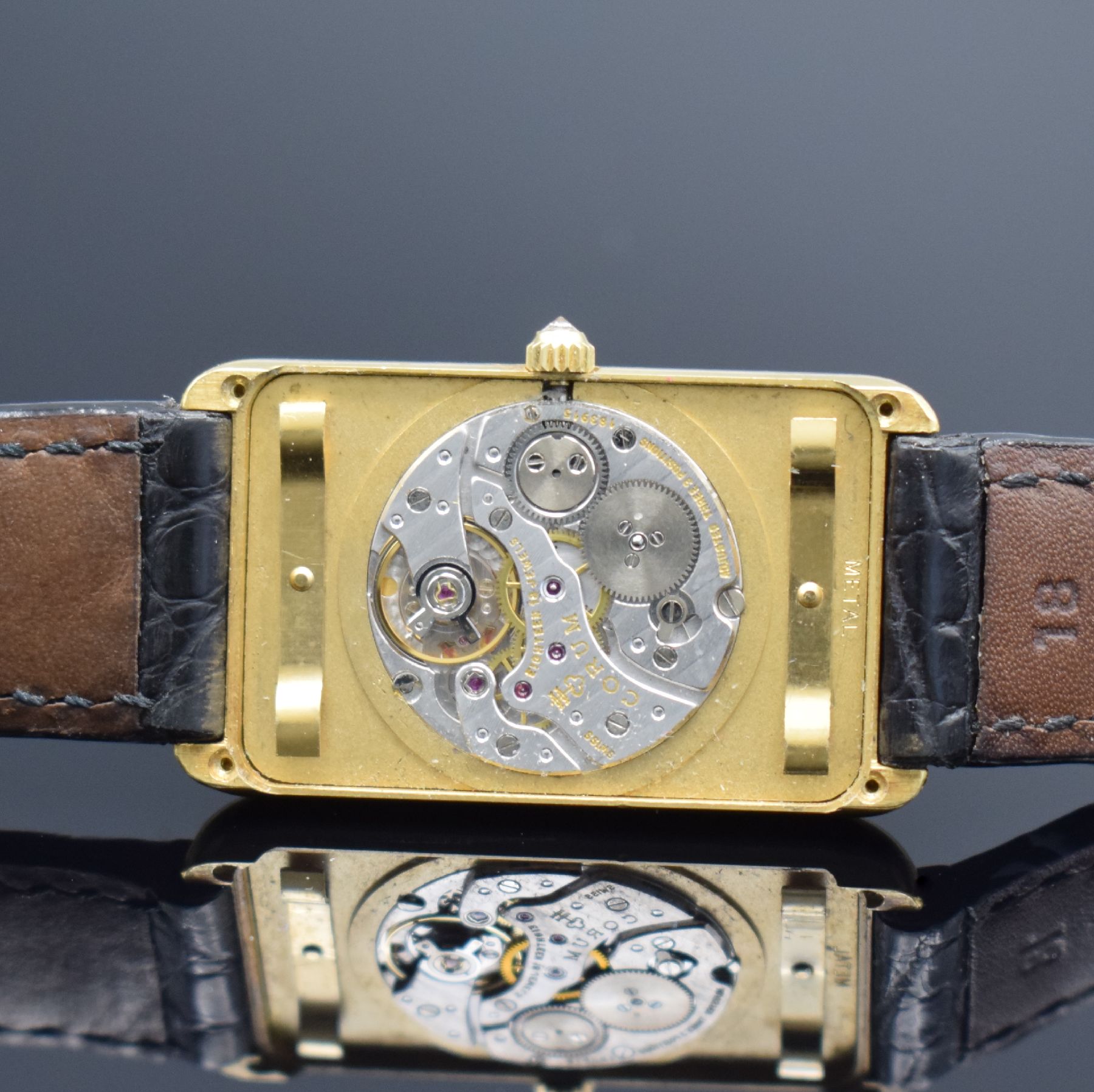 Detail e: CORUM Herrengolduhr in Form eines 15g Feingoldbarrens Nr. 3209 Referenz 55400, Handaufzug, Schweiz für den US-Markt um 1978, Geh. massiv GG 750/000 ...