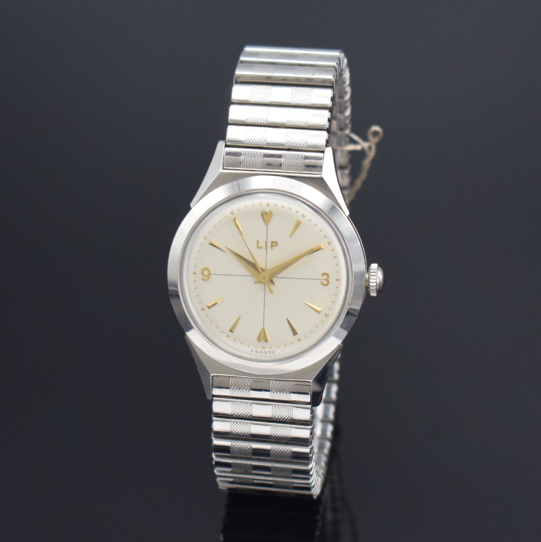 LIP nahezu neuwertige Armbanduhr in Stahl, Frankreich um 1955, Handaufzug, Boden verschr., orig. Flexband in Stahl, silb. Zifferbl. m. Fadenkreuz, ...