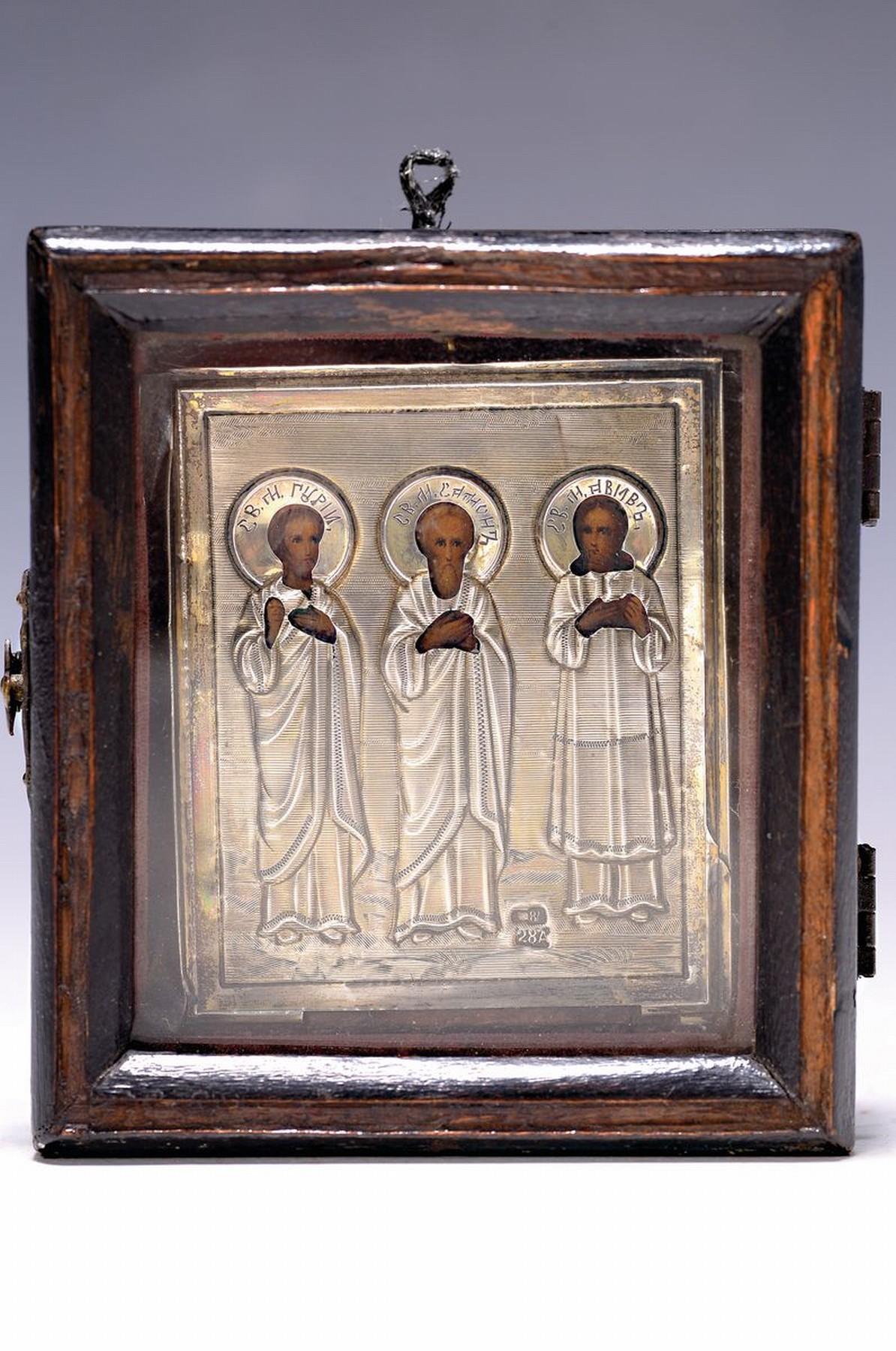 Ikone, Russland, um 1900, Reiseikone, drei Nationalheilige, 84er Silberoklad, im orig. Eingericht, ca. 6.5 x5.5 cm, Rahmen ca. 9 x 8 cm