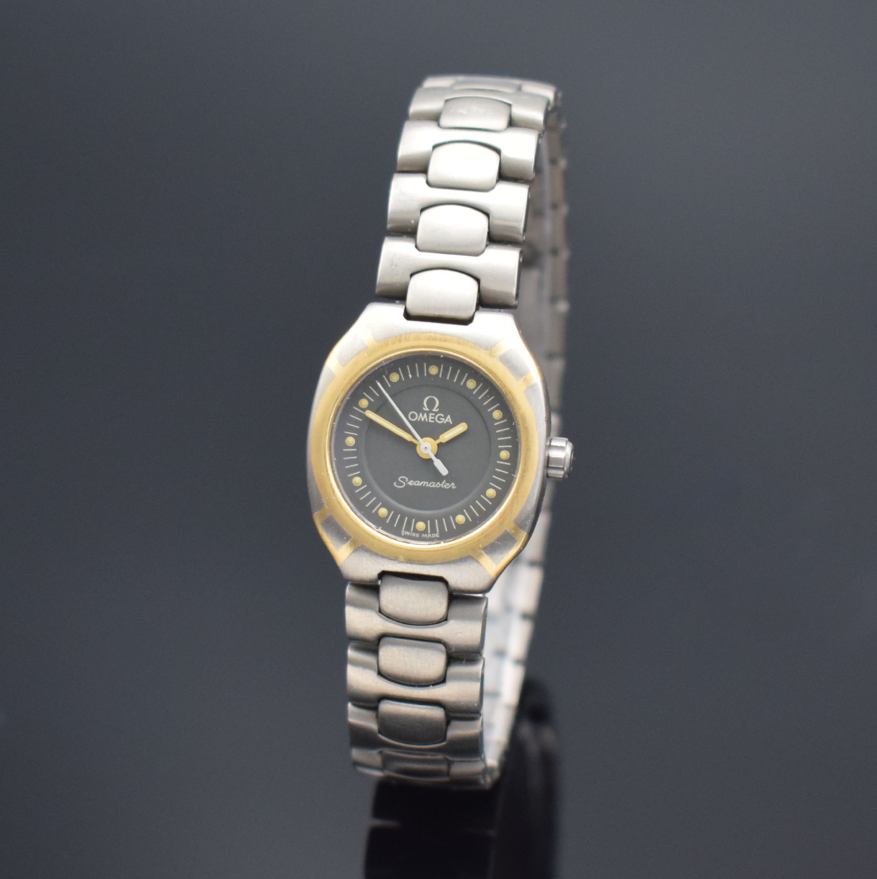 OMEGA Seamaster Polaris Damenarmbanduhr, Schweiz um 1985, quarz, z.T. goldintarsiertes Titangeh., Boden aufgedr., Titanband m. dopp. Faltschl., ...