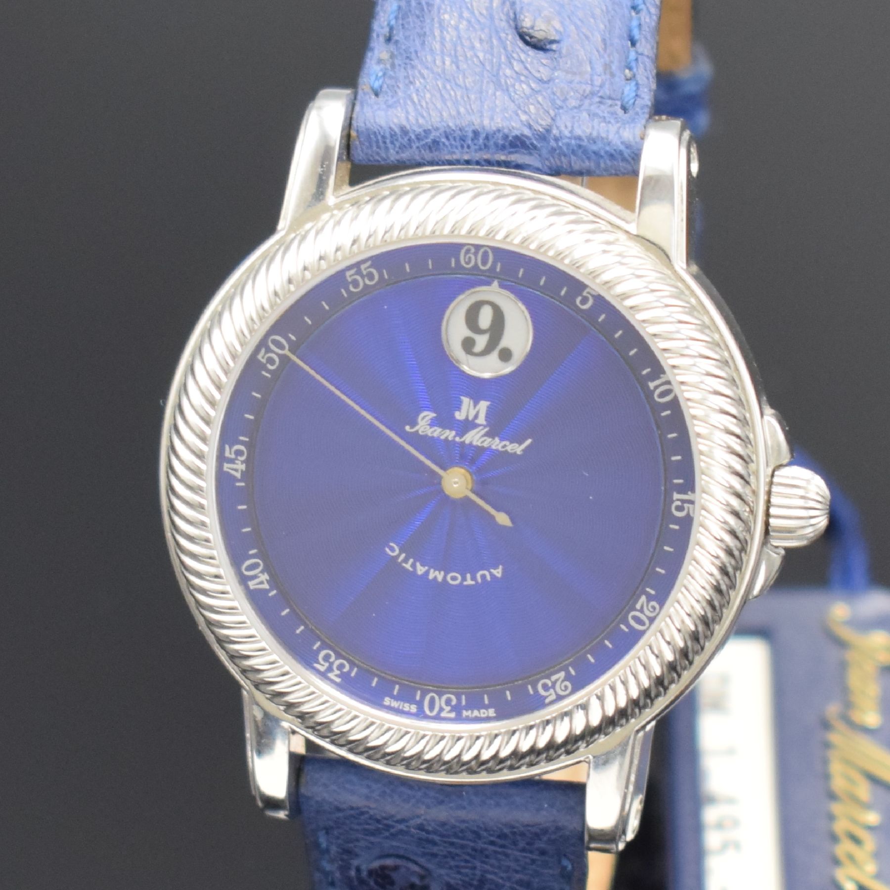 Detail a: JEAN MARCEL Herrenarmbanduhr mit wandernder springender Stunde, Schweiz um 1995, Automatik, beids. vergl. Stahlgeh., Boden & Krone verschr., ...