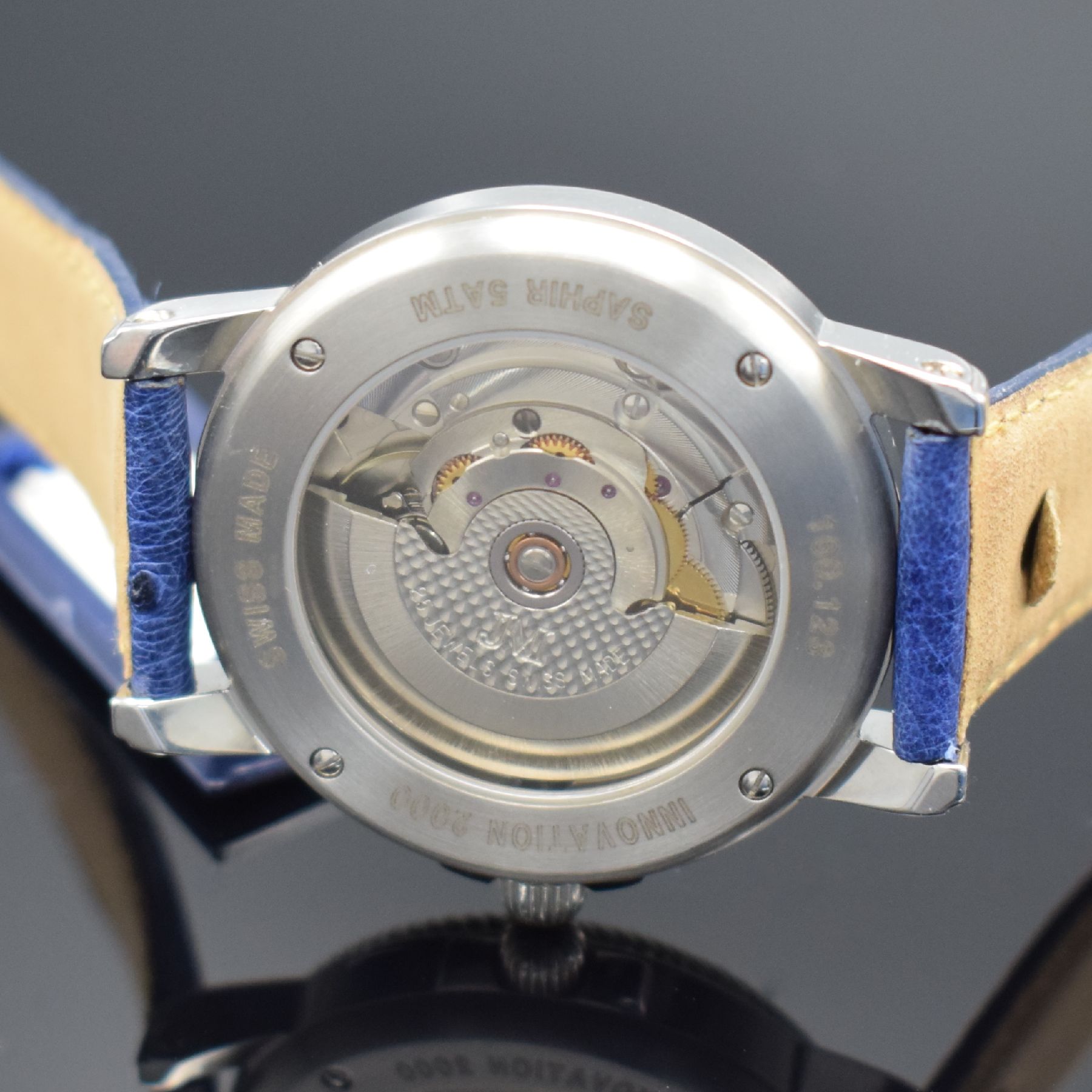 Detail e: JEAN MARCEL Herrenarmbanduhr mit wandernder springender Stunde, Schweiz um 1995, Automatik, beids. vergl. Stahlgeh., Boden & Krone verschr., ...