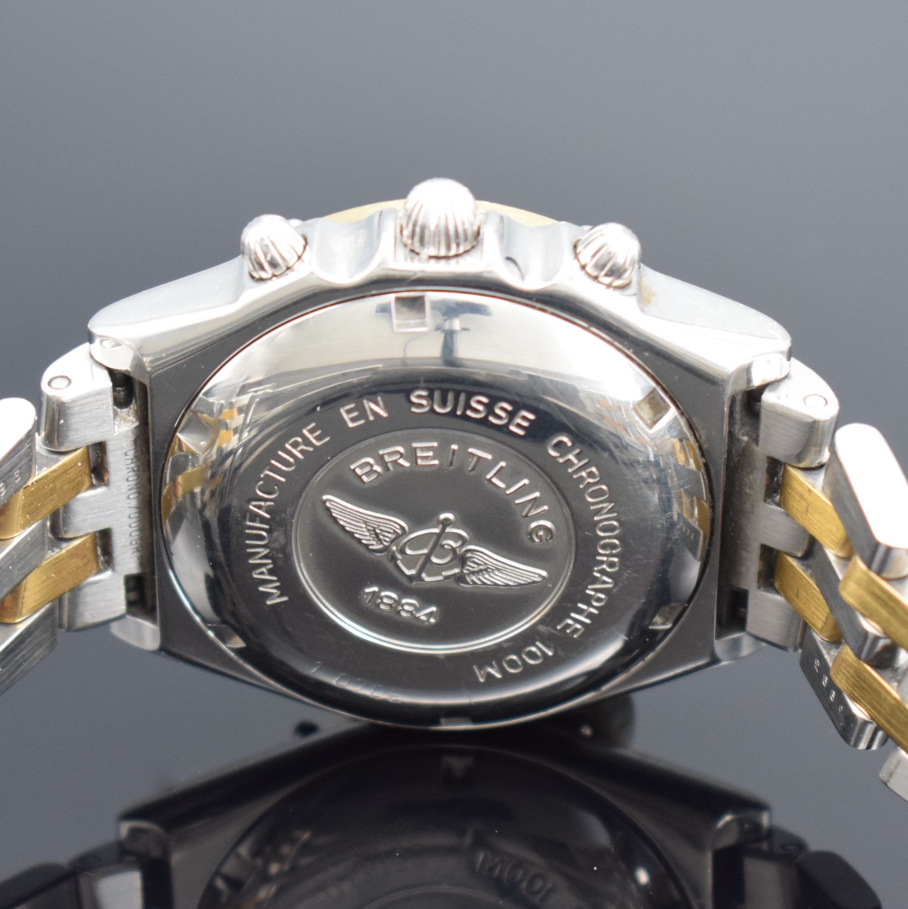 Detail e: BREITLING Herrenarmbanduhr Modellserie Chronomat Referenz D13050, Automatik, Edelstahl/Gold kombiniert inkl. Pilotband, Lün. m. 60er Teilung eins. ...