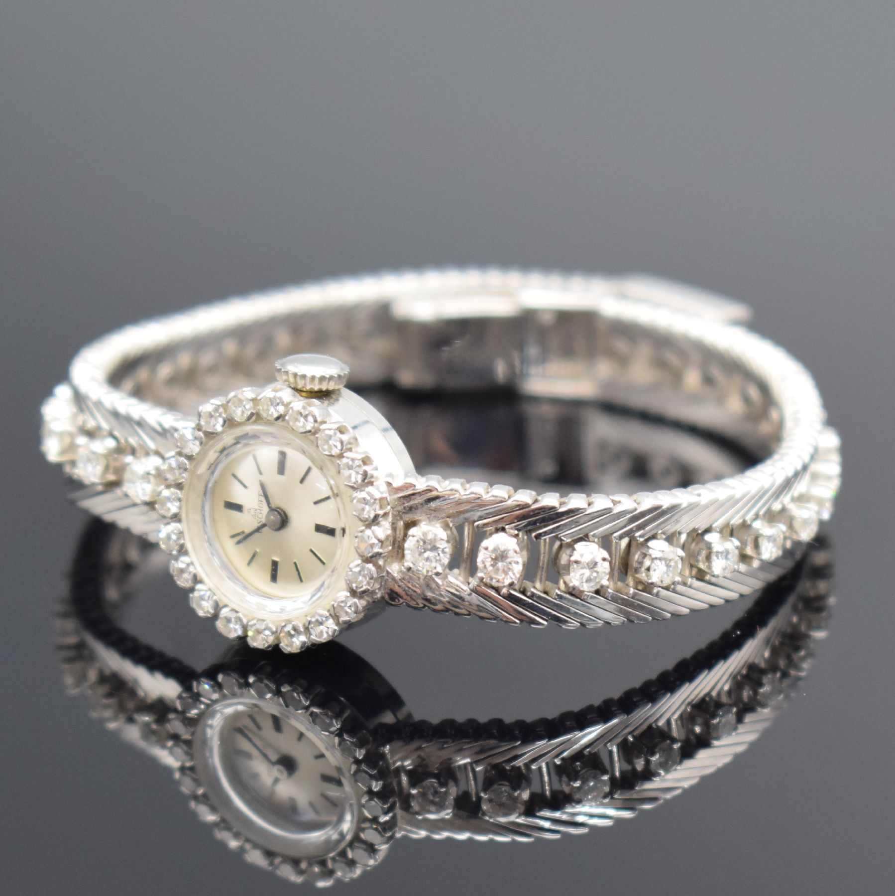 Detail d: BISCHOFF Damenarmbanduhr in WG 750/000 mit Diamanten, Schweiz um 1965, Handaufzug, Geh. an Goldband in WG 750/000, Boden aufgedr., Lünette & Band m. ...