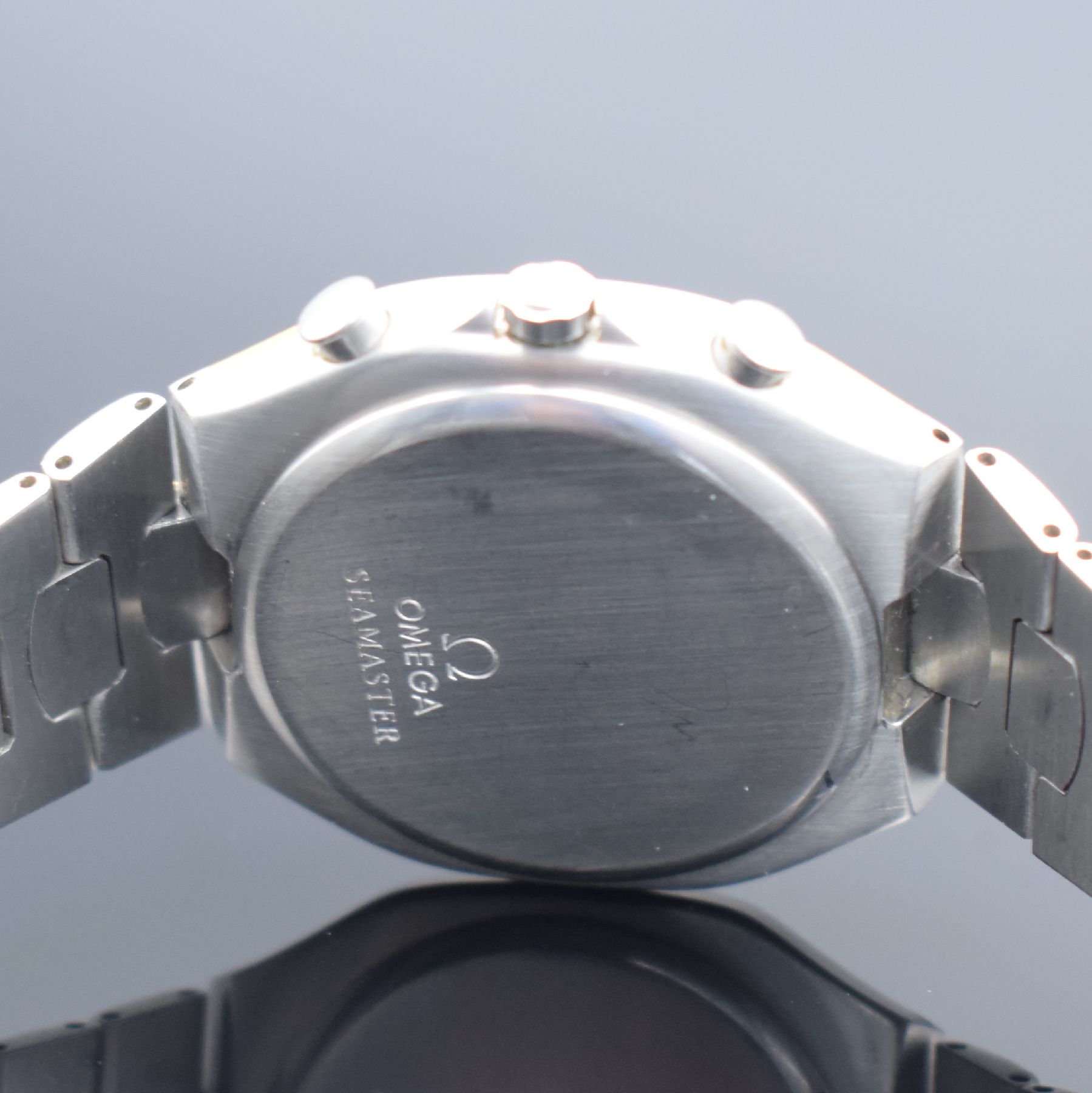 Detail e: OMEGA Seamaster Polaris Armbandchronograph Referenz 386.1031, Schweiz um 1990, quarz, goldintarsiertes Edelstahlgeh. inkl. z. T. verg. ...