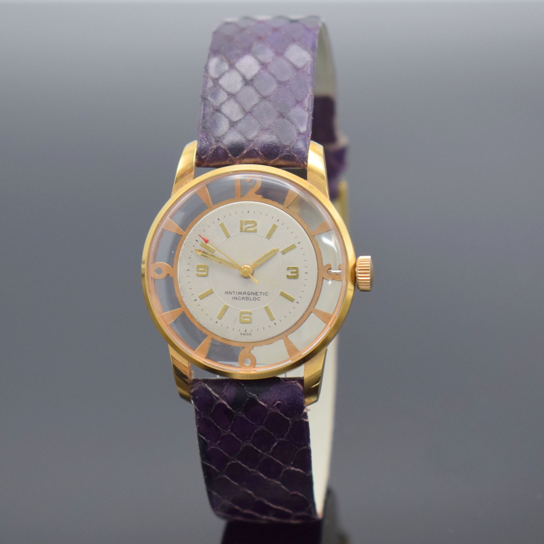 Ausgefallene Armbanduhr sog. Cocktail Watch, Schweiz um 1960, Handaufzug, verg. durchbr. Geh., silb. Zifferbl. m. aufges. Std.-Ind., gold. Zeiger, ...