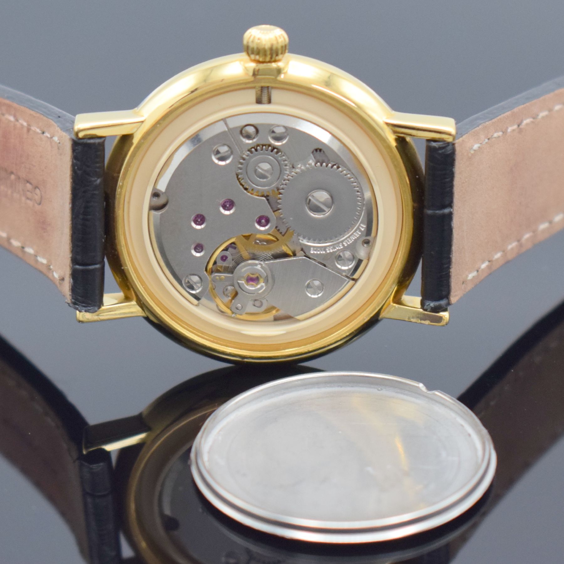 Detail f: Herrenarmbanduhr mit Kaliber Peseux 7046, Schweiz um 1990, Handaufzug, verg. Gehäuse, Stahlboden aufgedr., silb. guill. Zifferbl. mit röm. Zahlen, ...