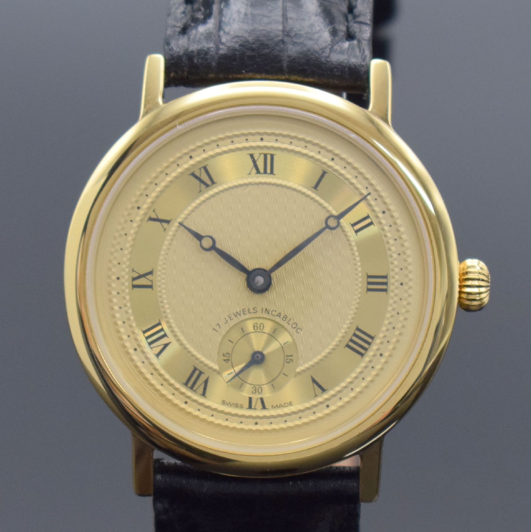 Detail a: Herrenarmbanduhr mit Kaliber Peseux 7046, Schweiz um 1990, Handaufzug, verg. Gehäuse, Stahlboden gedr., verg. guill. Zifferbl. mit röm. Zahlen, ...
