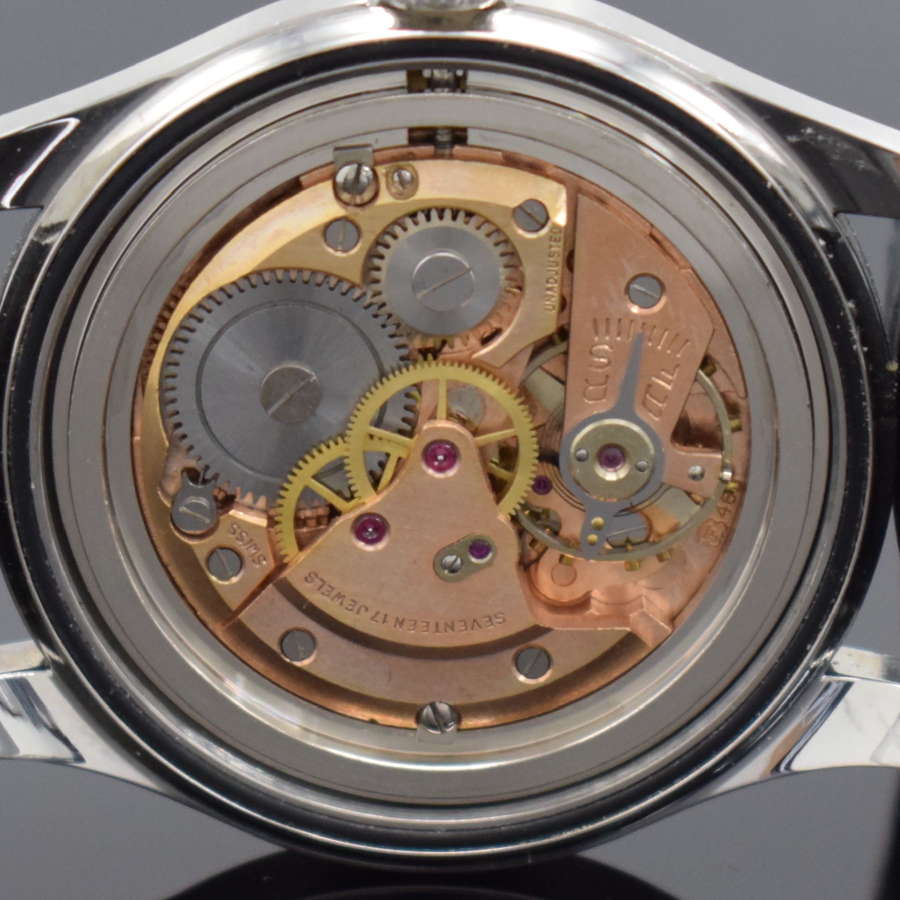 Detail h: ARLY Natostar Herrenarmbanduhr, Werk Schweiz um 1955, Handaufzug, verschr. Boden & Geh. später, schwarzes Zifferbl. m. arab. Zahlen, weiße Zeiger, ...