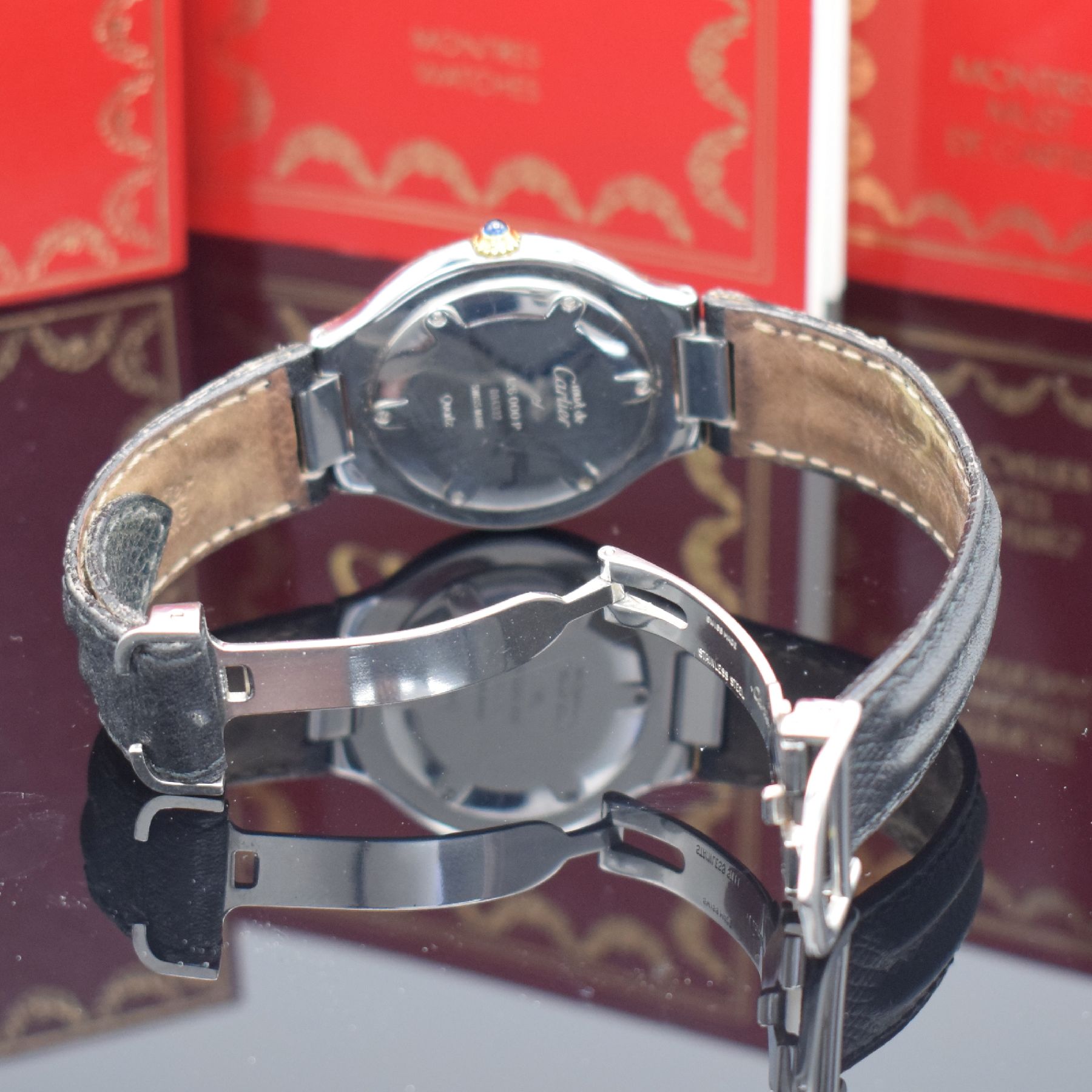 Detail b: CARTIER Armbanduhr Linie 21, Schweiz um 2000, Edelstahlgeh. inkl. orig. Lederband m. orig. Faltschl., quarz, Lünette m. grav. röm. Std., gebl. ...