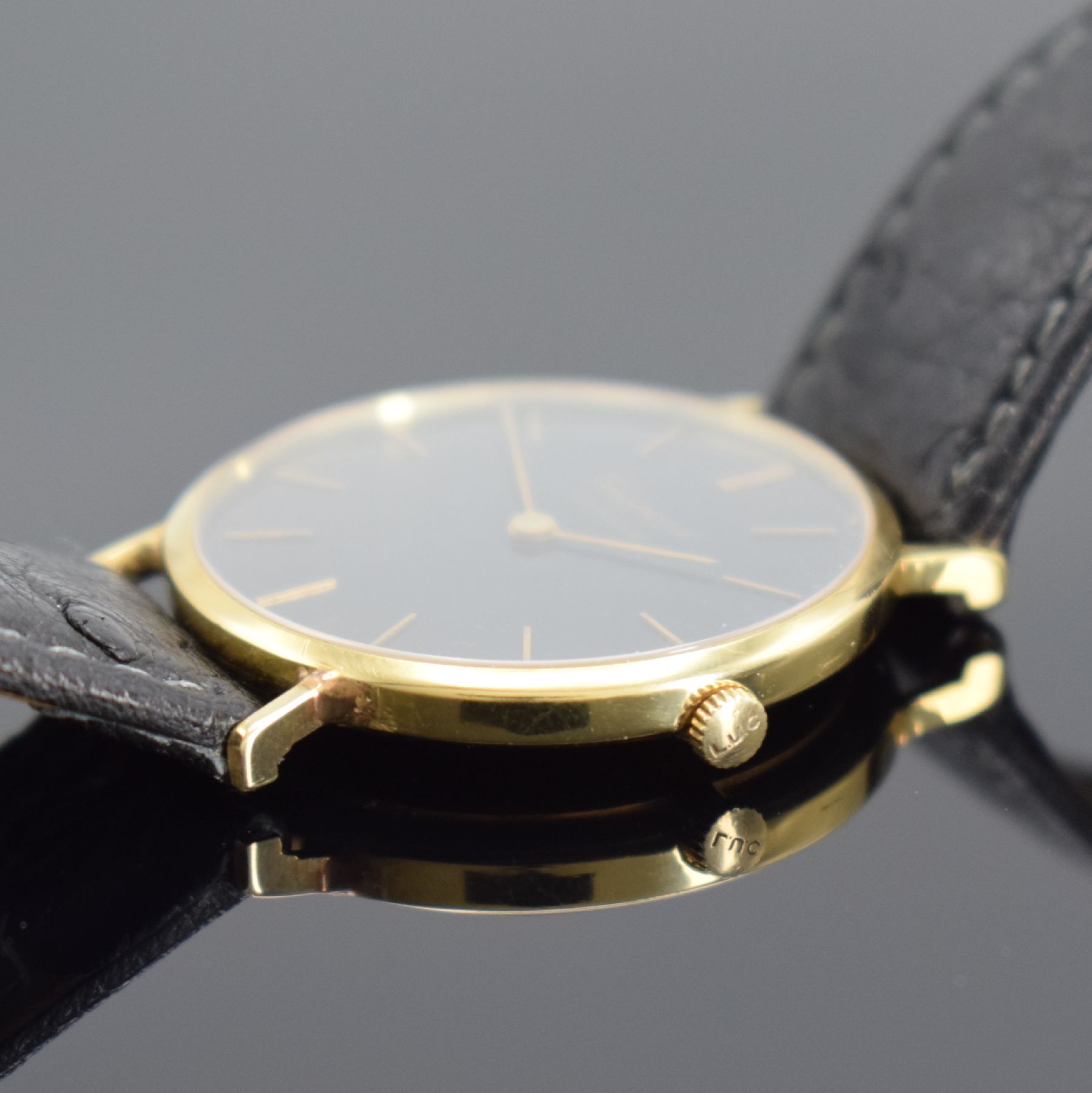 Detail b: CHOPARD Armbanduhr in GG 750/000 Referenz 1013, Schweiz um 1990, Handaufzug, Boden aufgedr., schwarzes Zifferbl. rest., gold. Std.-Ind & gold. ...
