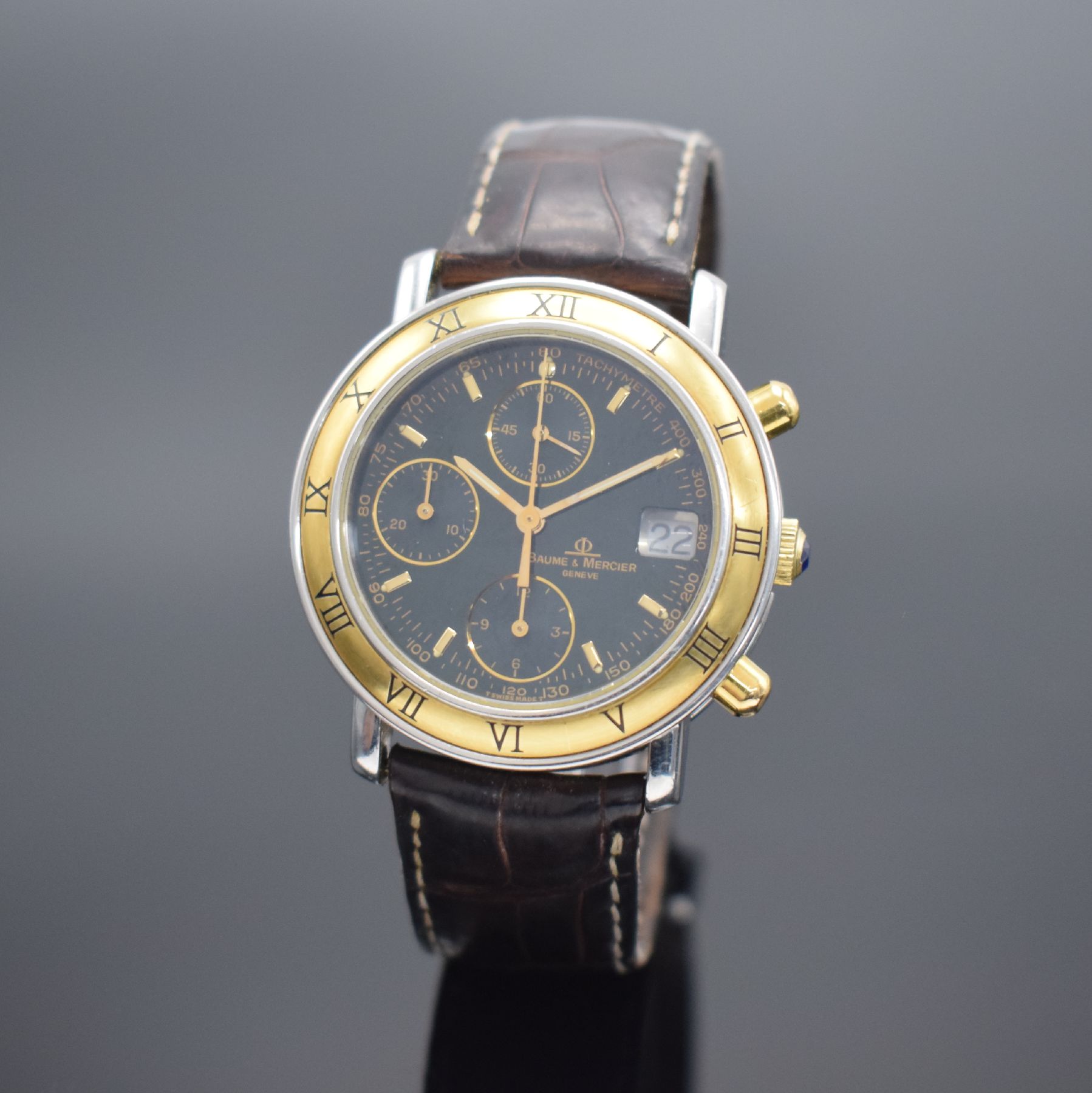 BAUME & MERCIER Baumatic Herrenarmbanduhr mit Chronograph in Stahl/Gold, Schweiz um 1990, Automatik, Ref. 6104.018, Boden aufgedr., orig. Lederband ...