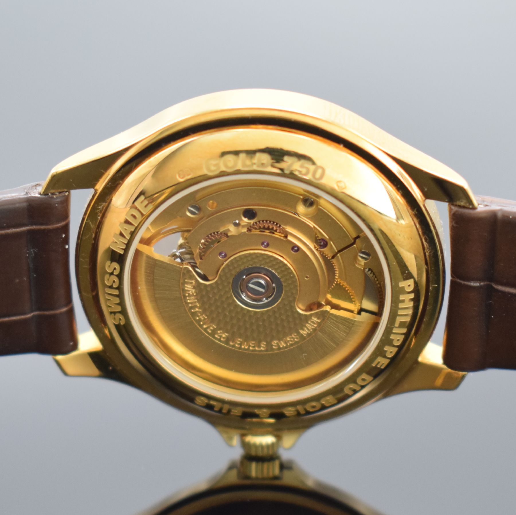 Detail e: PH. DU BOIS & FILS Herrenarmbanduhr in GG 750/000, Schweiz um 2005, Automatik, beids. vergl. Geh., Boden aufgedr., orig. Lederband m. orig. verg. ...