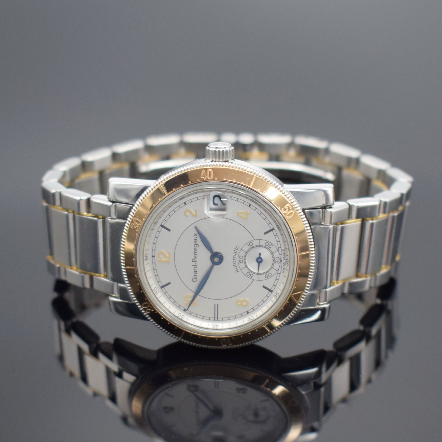 Detail b: GIRARD PERREGAUX Herrenarmbanduhr, Schweiz um 1995, Automatik, Edelstahl/Gold komb., Boden 6-fach verschr. (3x Schr. def. / nicht zu lösen), ...