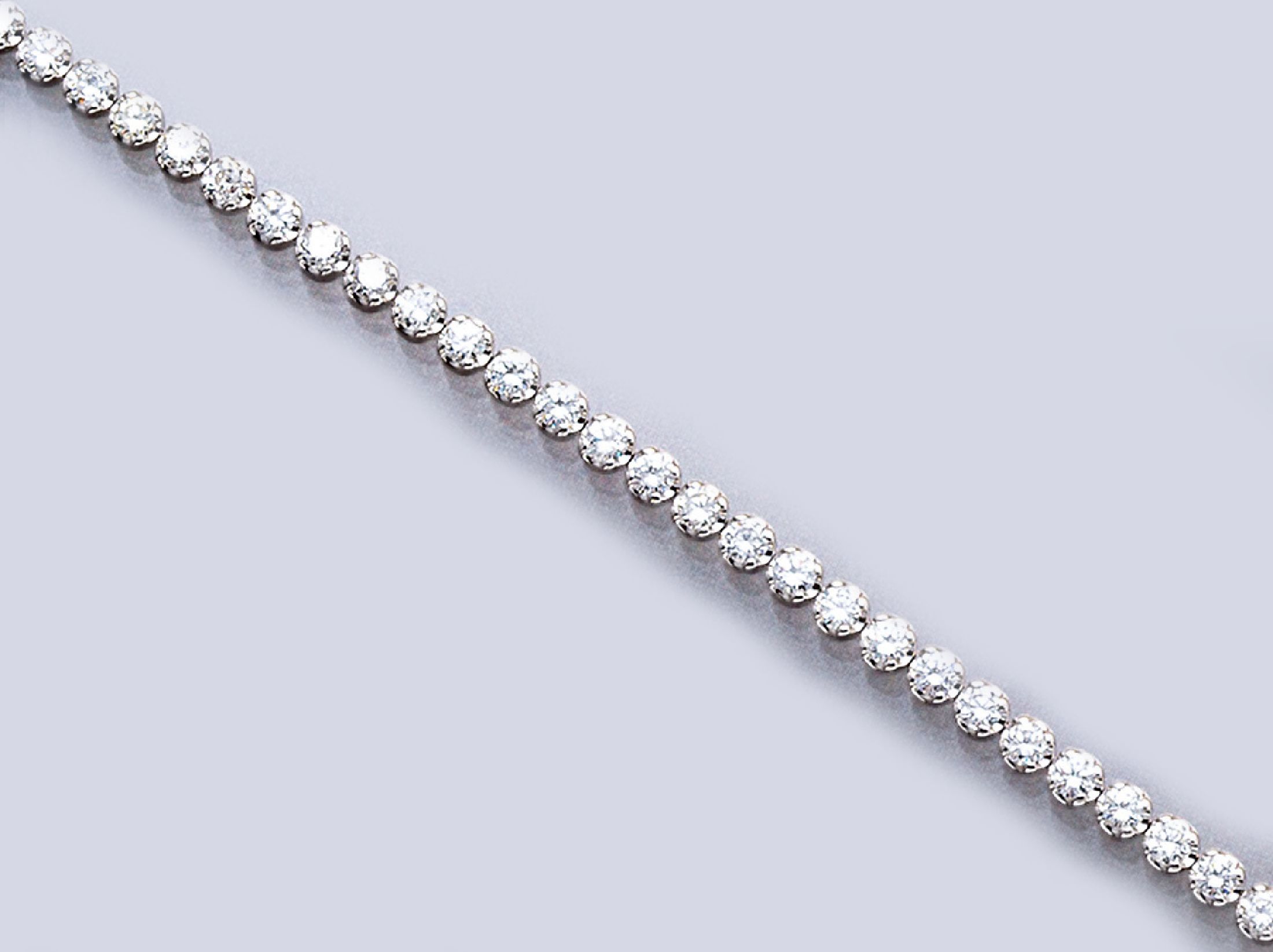 14 kt Gold Brillant-Linienarmband, WG 585/000, Brillanten zus. ca. 3.16 ct feines Weiß-Weiß/lp-si, L. ca. 18.8 cm, Kastenschloß mit ...