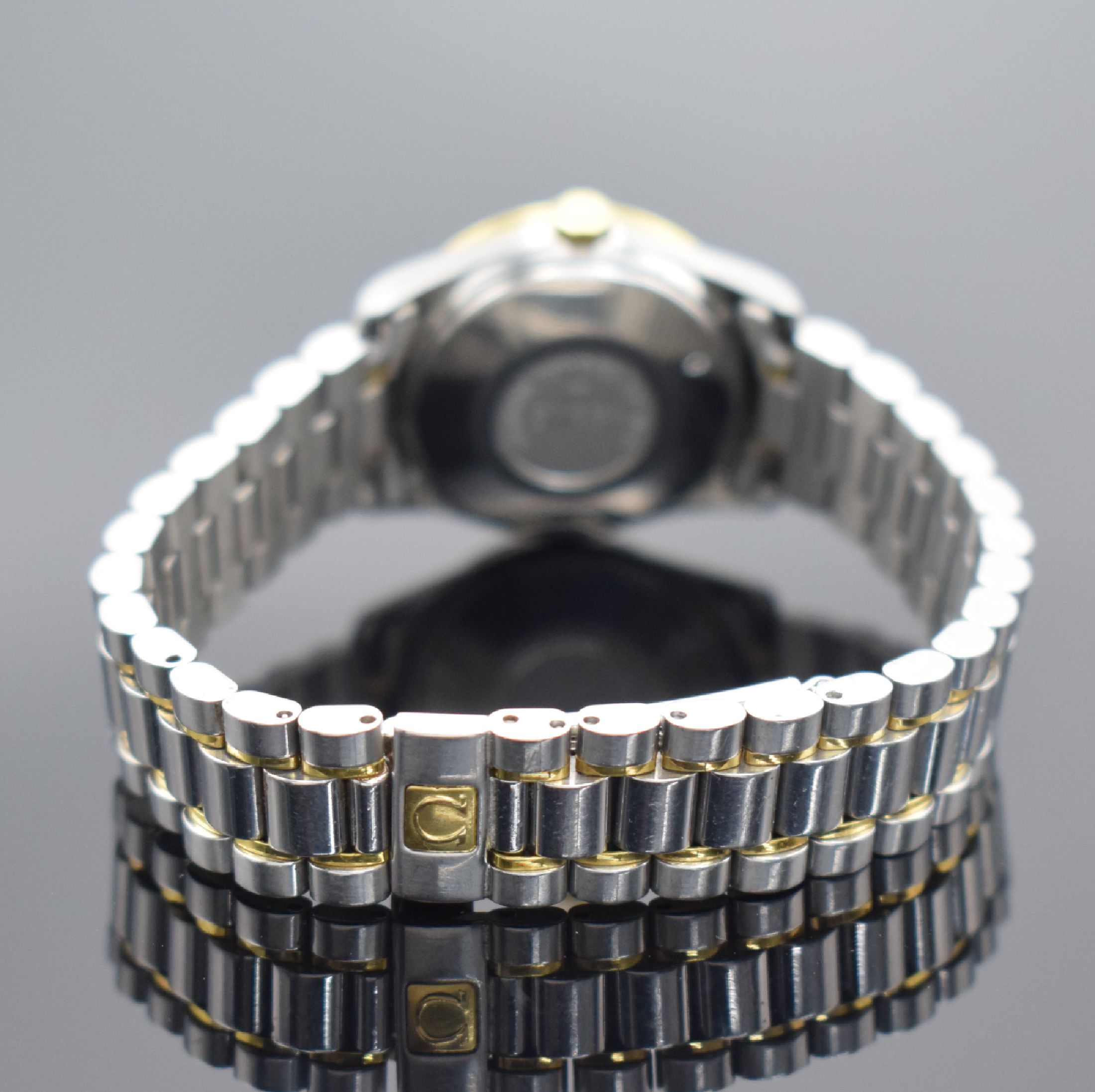 Detail c: OMEGA Classic Damenarmbanduhr in Stahl/Gold, Schweiz um 1990, Automatik, Ref. 566 0285, Boden aufgedr., orig. Gliederband m. Faltschl., weißes ...