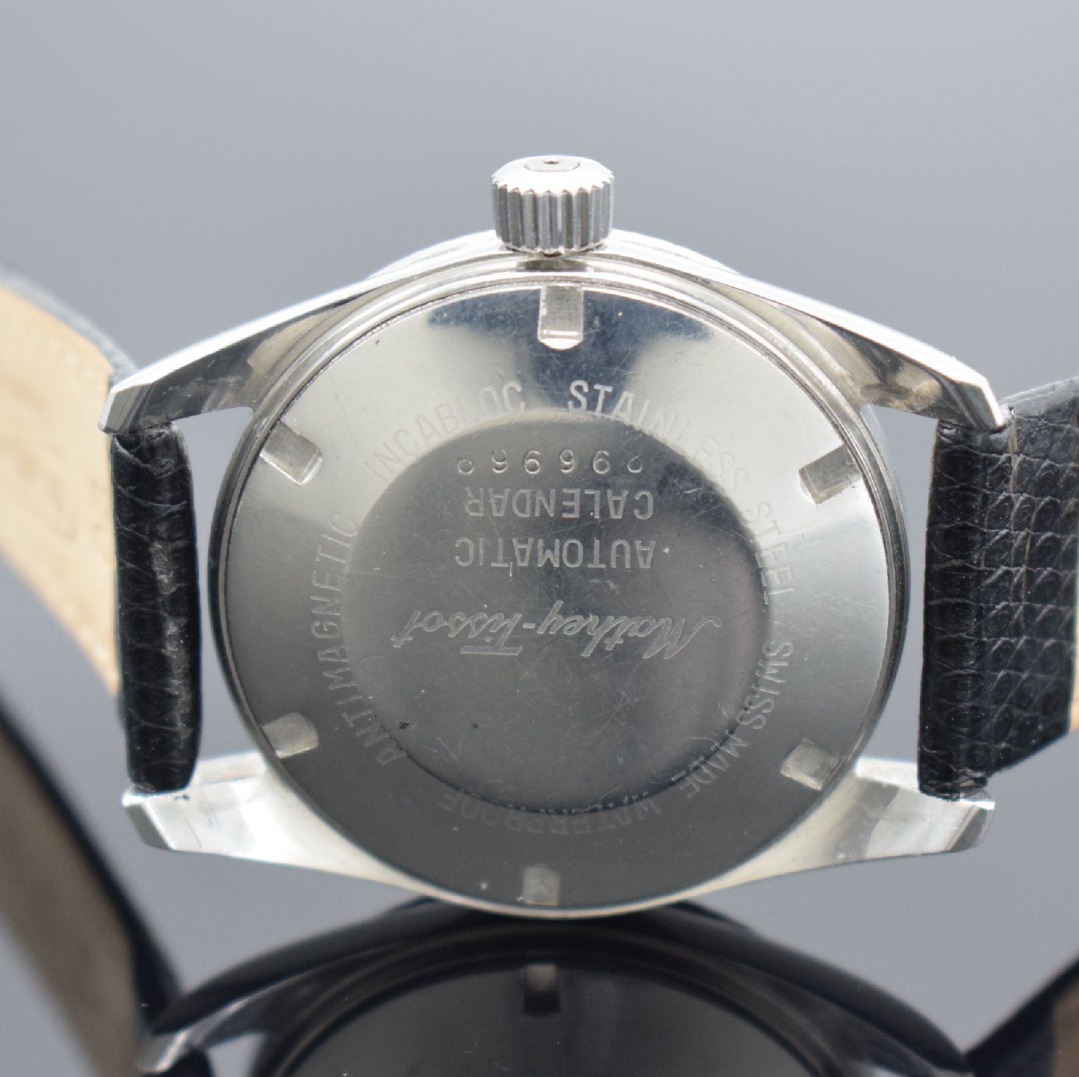Detail d: MATHEY-TISSOT Datic Herrenarmbanduhr in Stahl, Schweiz um 1965, Automatik, Boden & Krone verschr., rhod. Riffel-Lünette, silb. Tritium-Zifferbl. m. ...