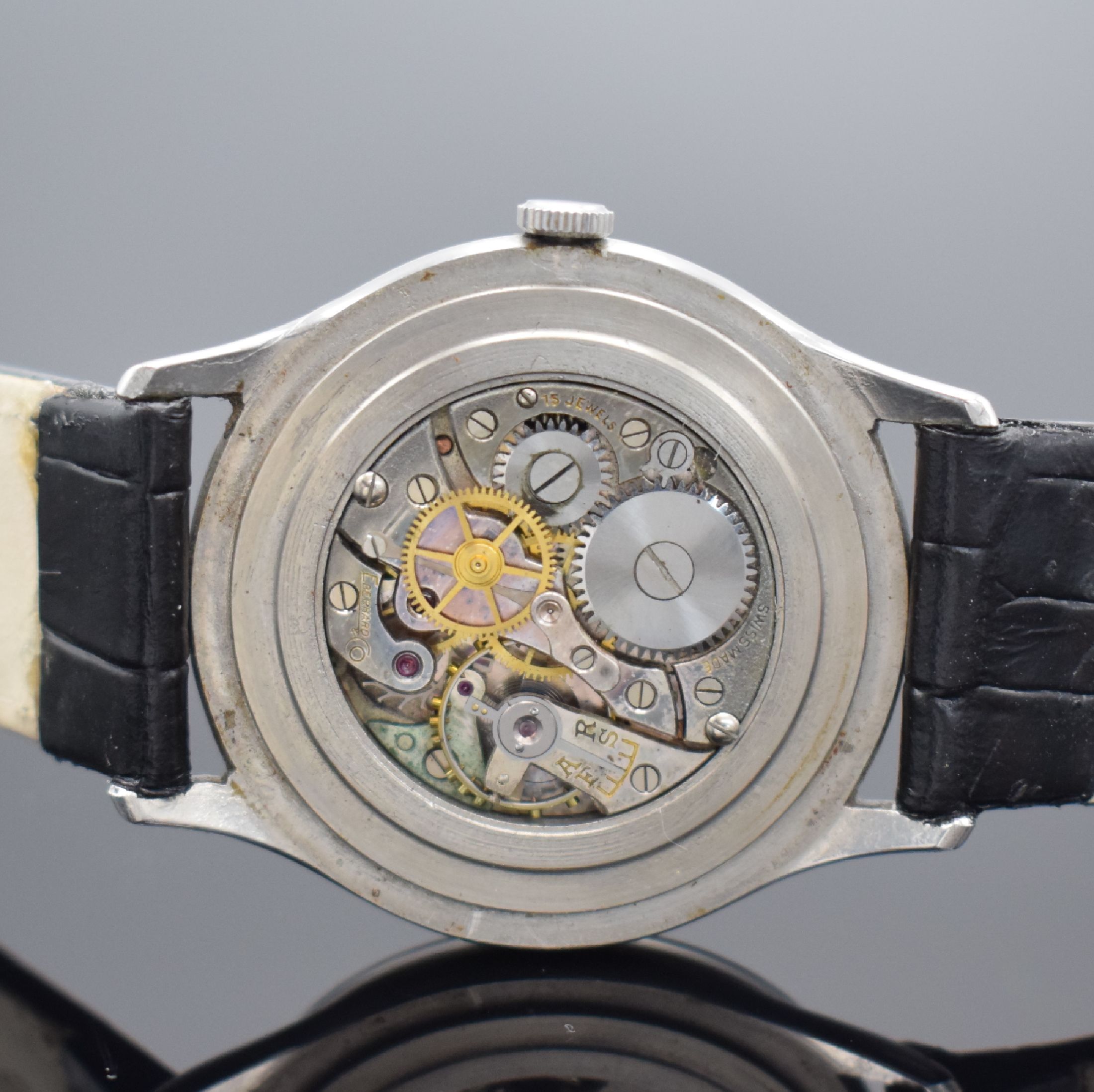 Detail d: EBERHARD & CO Herrenarmbanduhr in Stahl, Schweiz um 1940, Handaufzug, Boden aufgedr., silb. Zifferbl. pat., röm. Zahlen, gebl. Zeiger korrod., ...