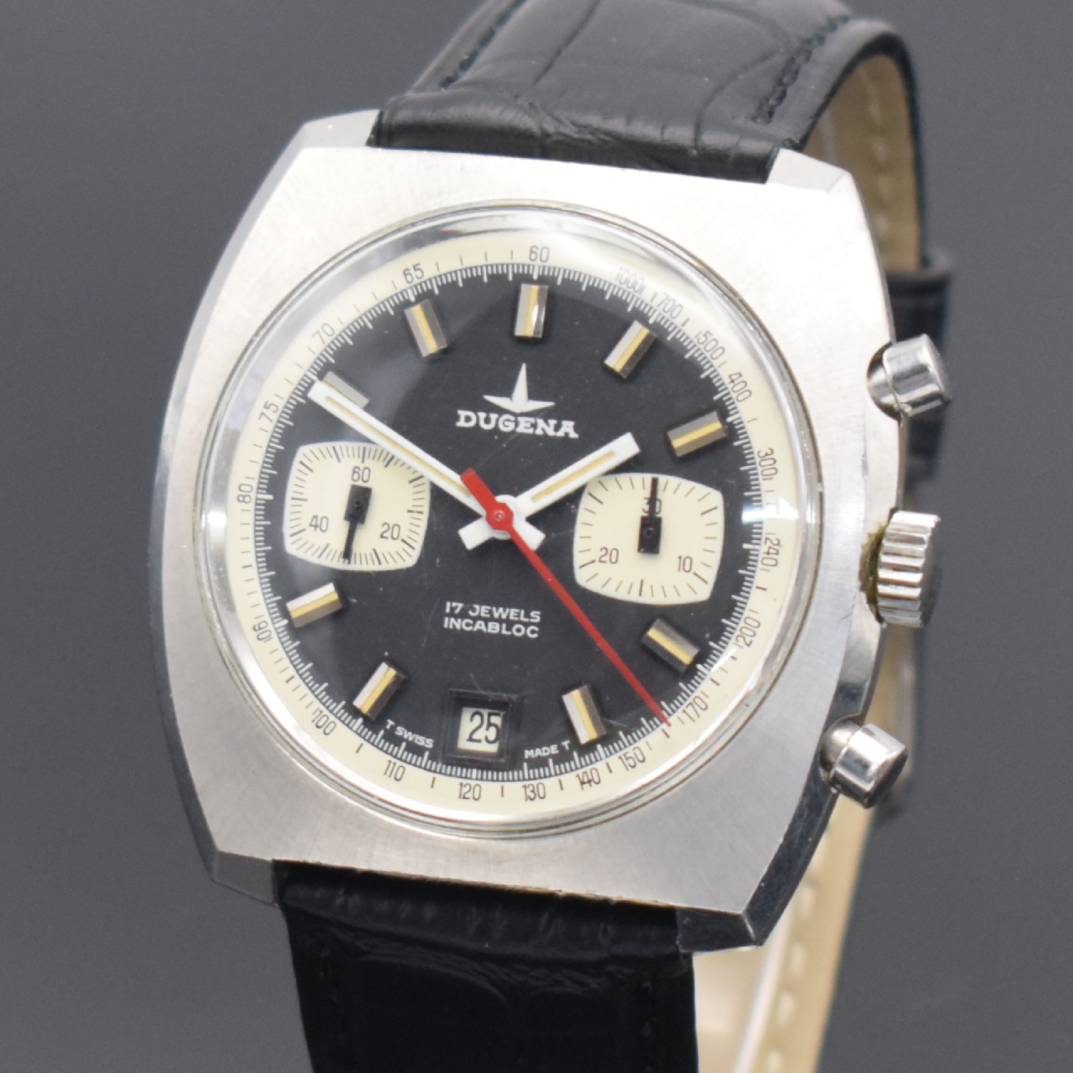 Detail a: DUGENA Herrenchronograph in Stahl, Schweiz um 1970, Handaufzug, unpoliertes verschr. Geh., schwarzes Zifferbl., weiße Hilfsblätter & ...