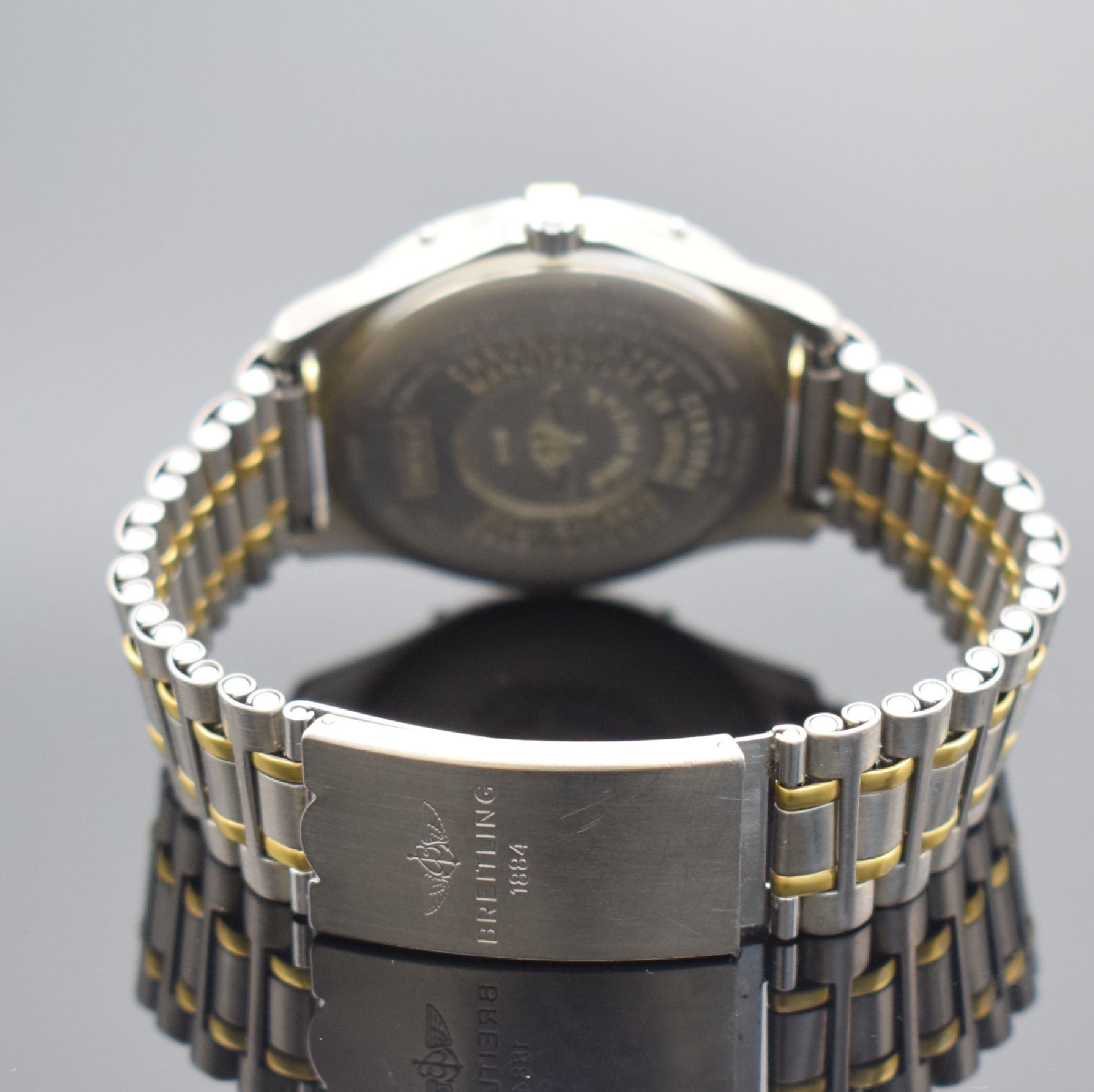 Detail d: BREITLING Aerospace Chronometer Multifunktionsuhr in Titan/Gold, Schweiz verk. lt. beil. Pap. 11/2002, quarz, Referenz F75362, Boden aufgedr., orig. ...
