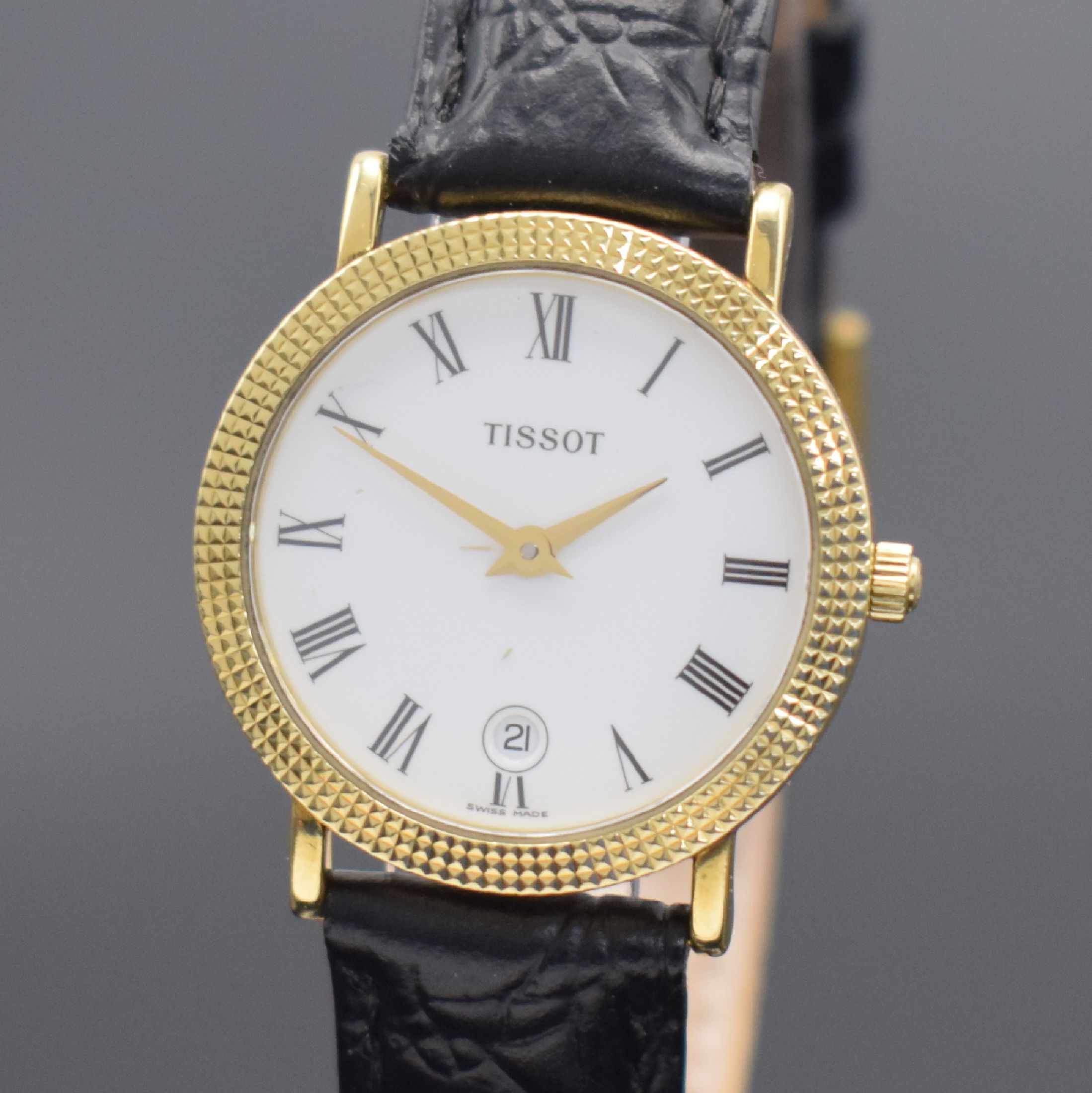 Detail a: TISSOT Damenarmbanduhr in GG 750/000, Schweiz um 1995, quarz, Boden aufgedr., Lünette m. Nagelmuster-Design, weißes Zifferbl. m. röm. Zahlen, ...