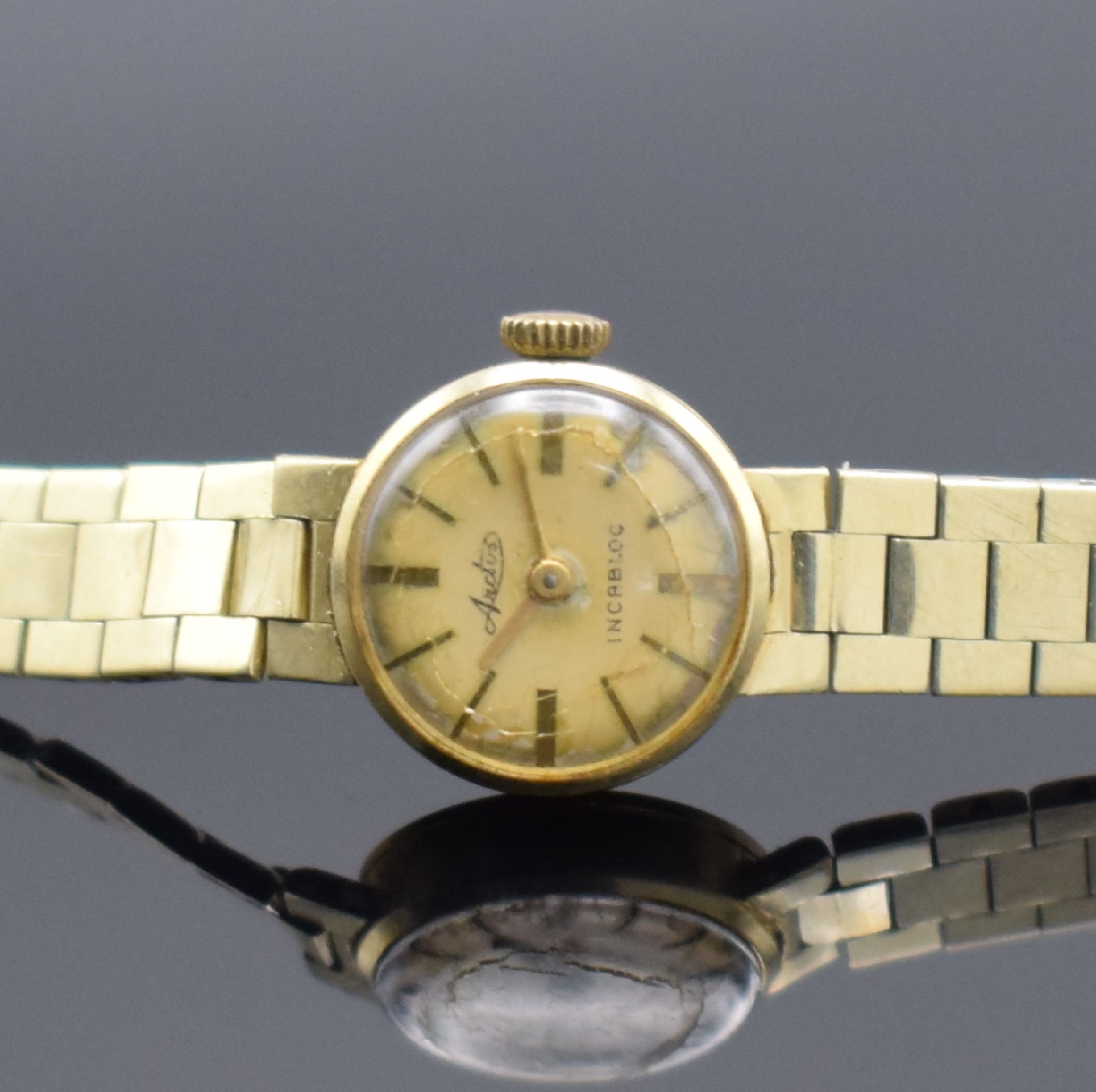 Detail a: ARCTOS Damenarmbanduhr in GG 585/000, Schweiz 1960er Jahre, Handaufzug, Boden aufgedr., an GG 585/000 Armband, silb. Zifferbl. stark pat./fl., gold. ...