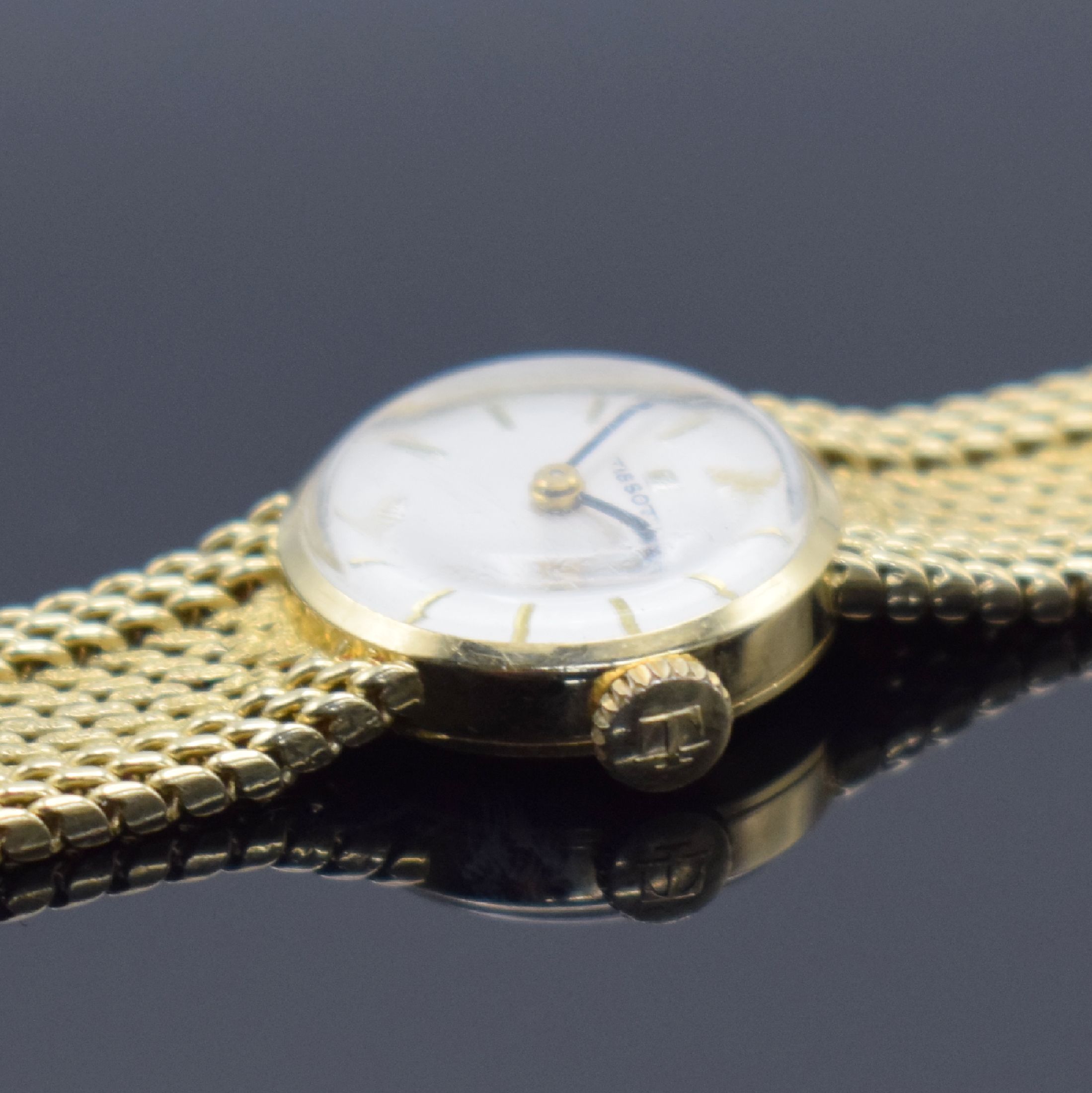 Detail d: TISSOT Damenarmbanduhr in GG 585/000, Schweiz um 1960, Handaufzug, Boden aufgedr., Geh. an GG 585/000 Armband, silb. Zifferbl. m. gold. Std.-Ind., ...