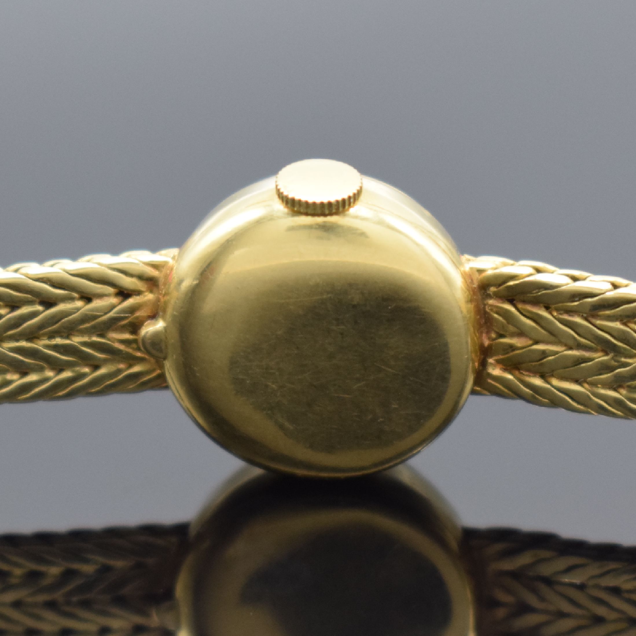 Detail c: GÜBELIN Damenarmbanduhr in GG 750/000, Schweiz 1960er Jahre, Handaufzug, Boden aufgedr., GG 750/000 Armband, silb. Zifferbl. m. gold. Std.-Ind. & ...