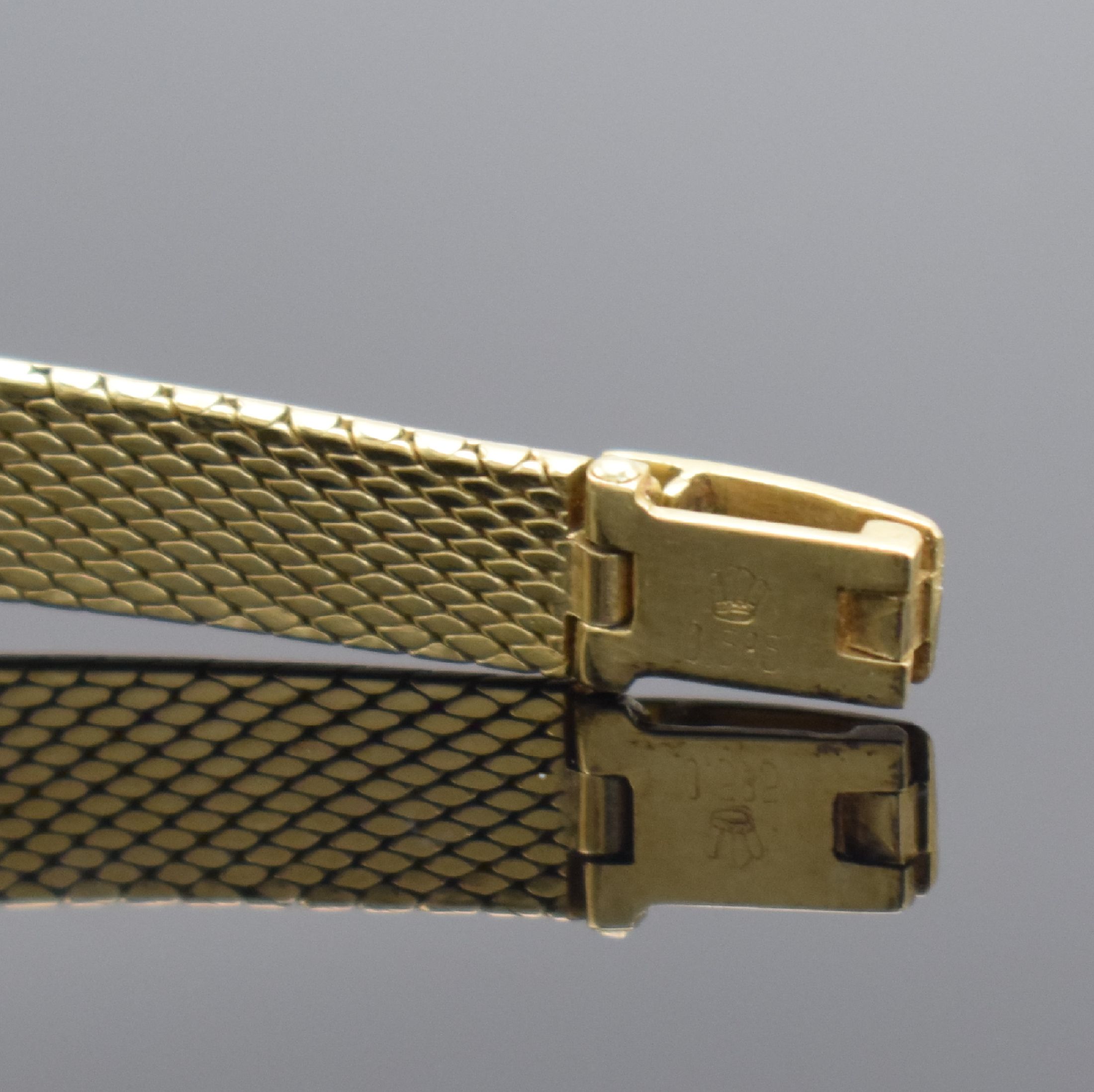Detail b: EXQUISIT Damenarmbanduhr in GG 585/000, Schweiz 1960er Jahre, Handaufzug, Geh. an Goldband in GG 585/000, Boden aufgedr., silb. Zifferbl. m. aufgel. ...