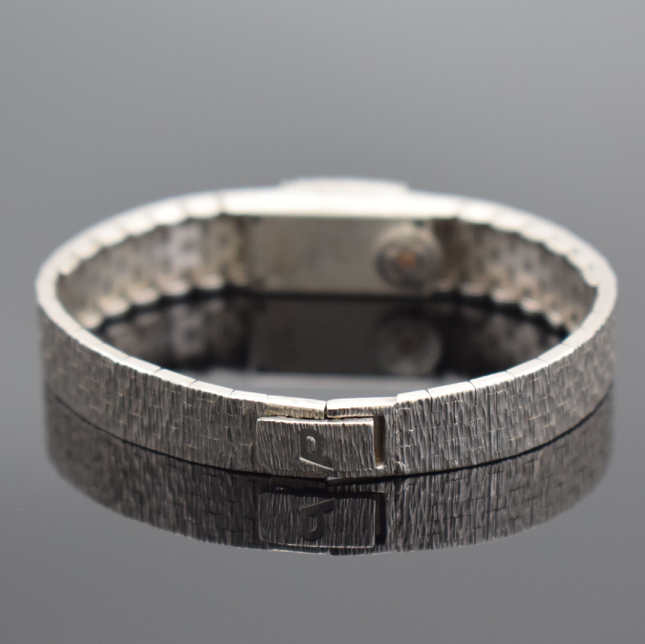 Detail b: PIAGET Damenarmbanduhr in WG 750/000 mit Diamantbesatz, Schweiz um 1960, Handaufzug, Ref. 1308 A6, inkl. Goldband in WG 750/000, Lünette aufw. m. ...