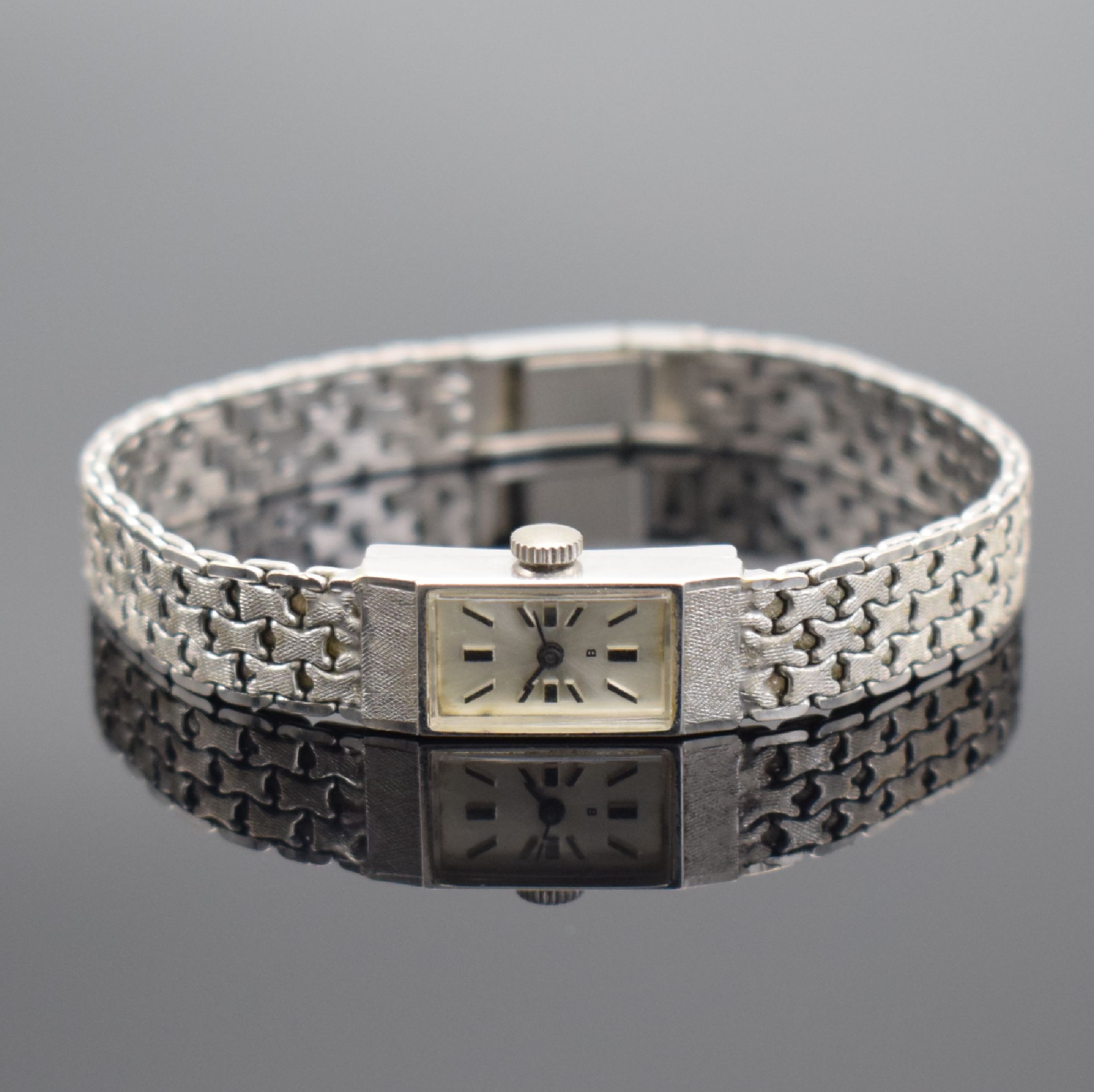 Detail b: Damenarmbanduhr in WG 585/000, Schweiz 1960er Jahre, Handaufzug, Geh. an Goldband in WG 585/000, Boden aufgedr., silb. Zifferbl. m. aufgel. Std.-Ind. ...