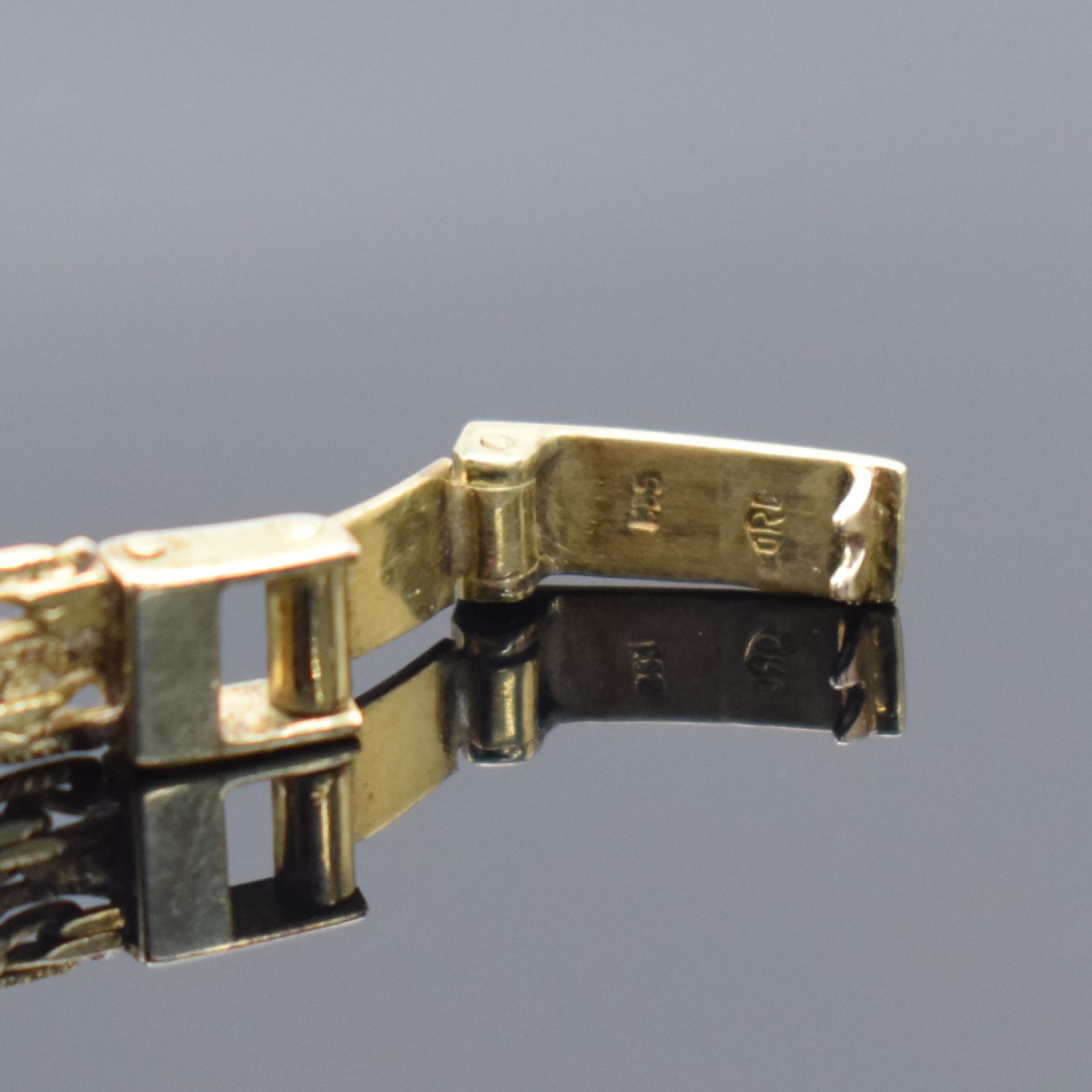 Detail b: KRÖNER Damengoldbanduhr in GG 585/000, Schweiz 1960er Jahre, Handaufzug, Geh. an Goldband in GG 585/000, Boden aufgedr., goldfarb. Zifferbl. m. ...
