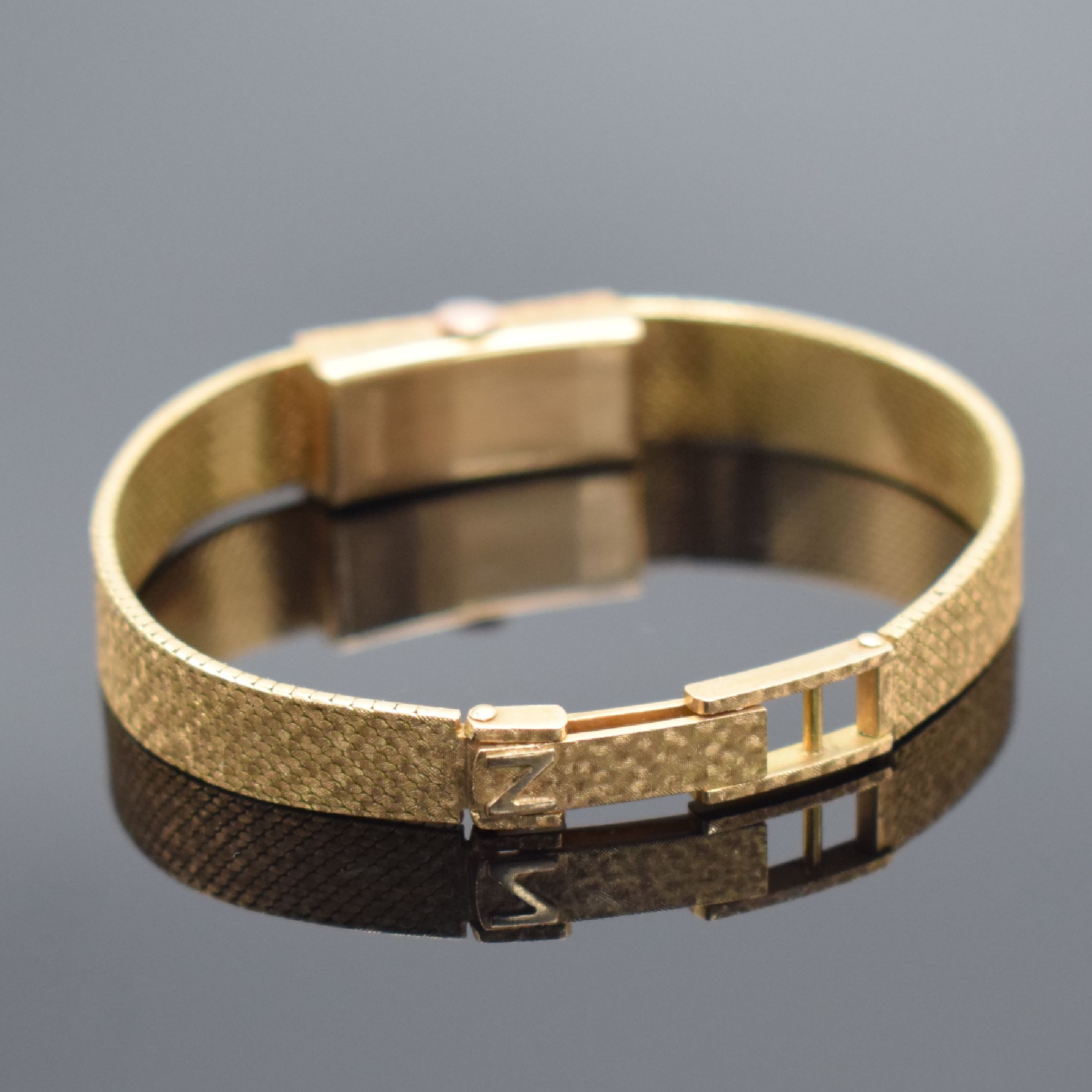 Detail b: NIVOR Damenarmbanduhr in RoséG 750/000, Schweiz 1960er Jahre, Handaufzug, Geh. an Goldband in RoséG 750/000, Boden aufgedr., silb. Zifferbl. m. ...
