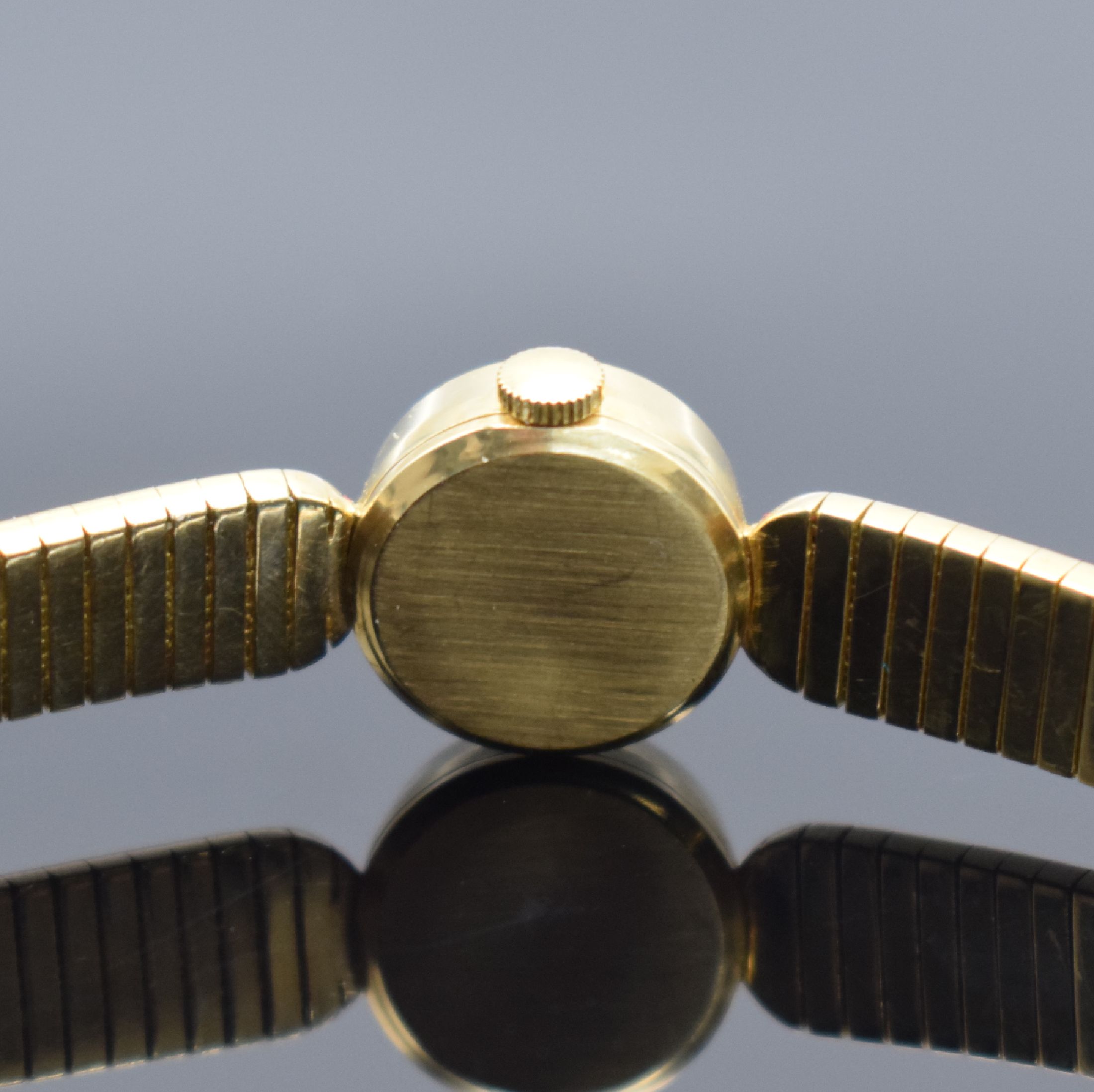 Detail d: GG 750/0000 Damenarmbanduhr, Schweiz 1960er Jahre, Handaufzug, GG 750/000 Armband, Boden aufgedr., silb. Zifferbl. m. gold. Std.-Ind. & Zeiger, Werk ...