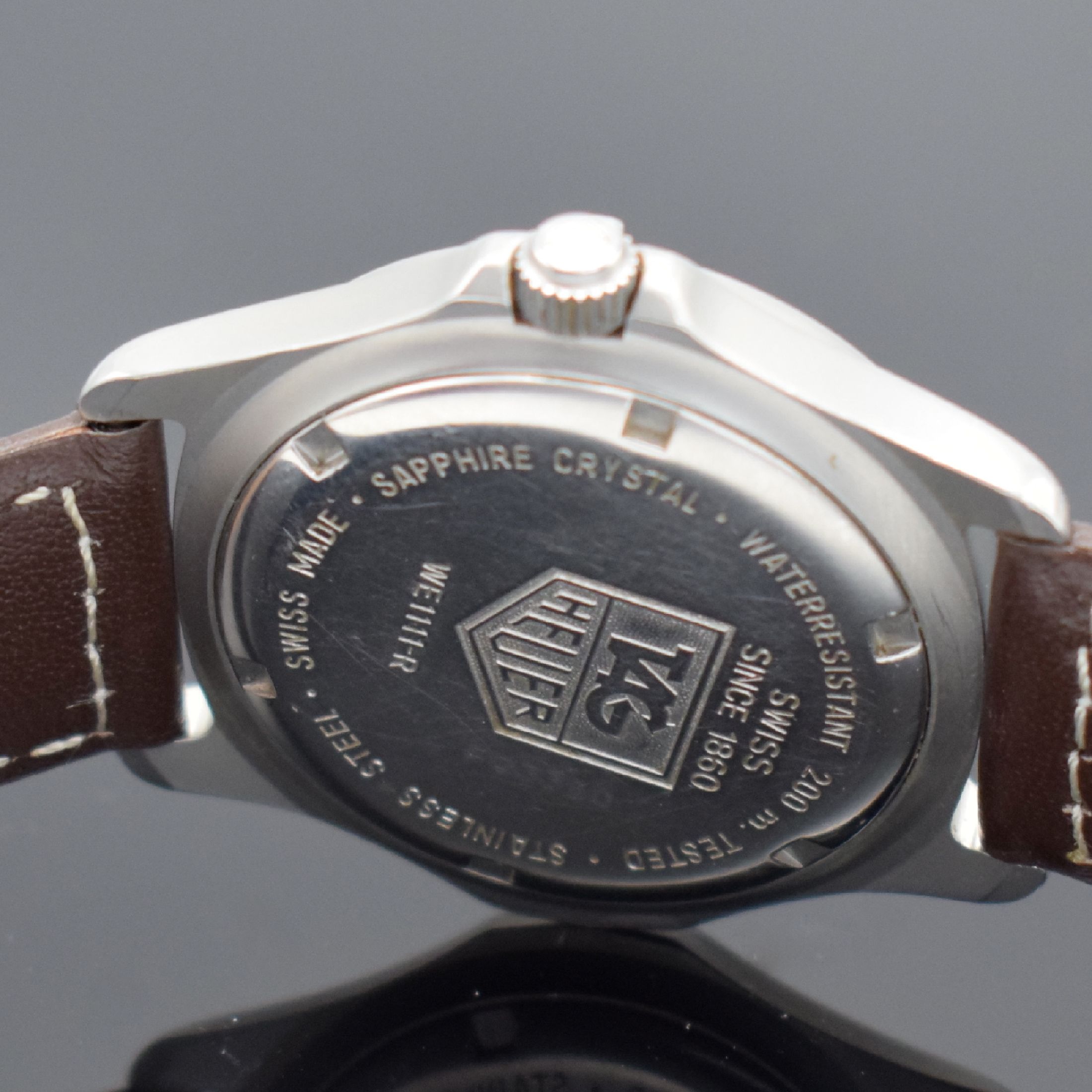 Detail d: TAG HEUER Professional Herrenarmbanduhr in Stahl, Schweiz um 1995, quarz, Ref. WE 1111 -R, matt. Geh., Boden & Krone verschr., Lünette m. 60er ...