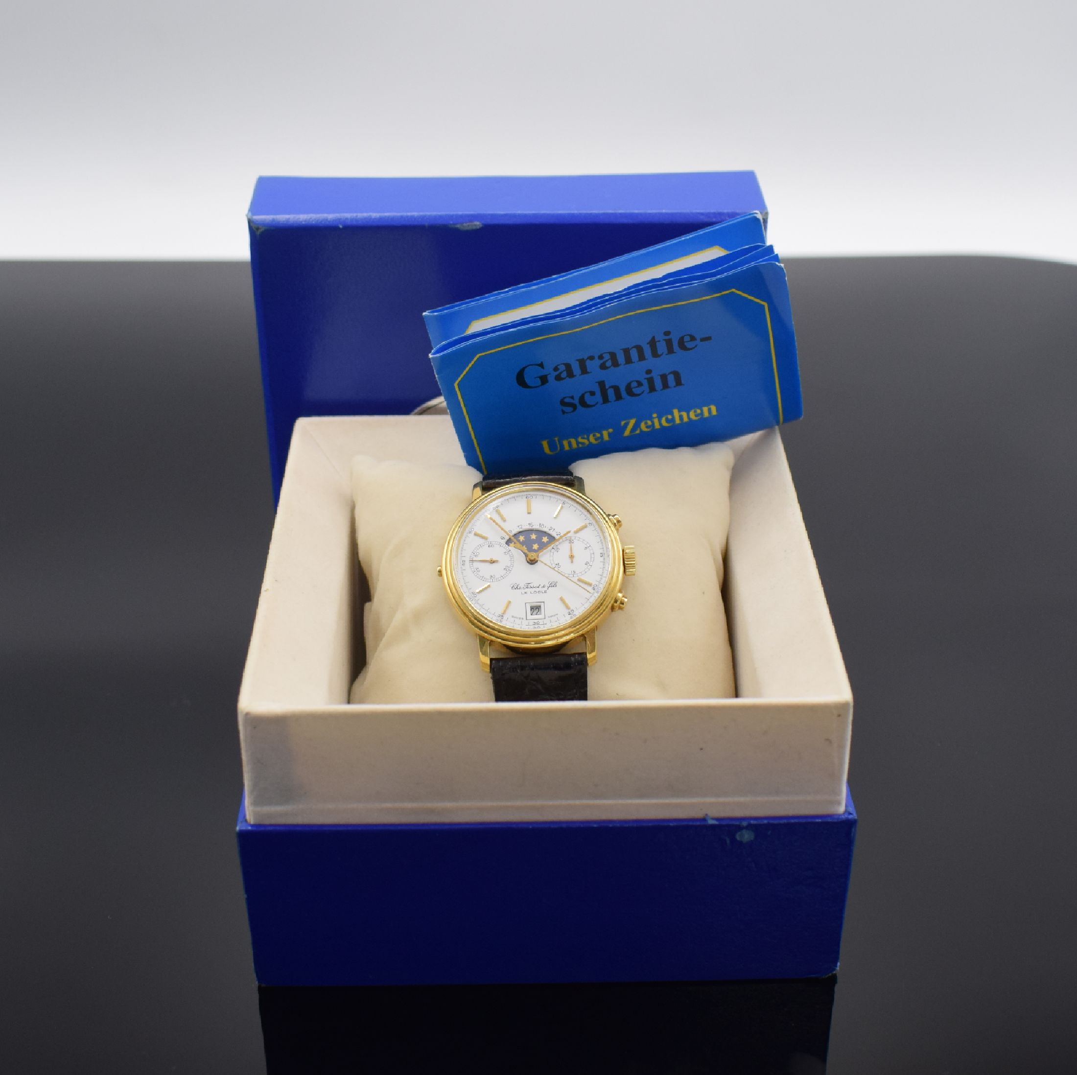 Detail g: TISSOT Le Locle Herrenchronograph mit Mondphase in GG 750/000, Schweiz um 1980, Handaufzug, Boden verschr., Korrekturdr. seitl. im Geh. b. 9, orig. ...