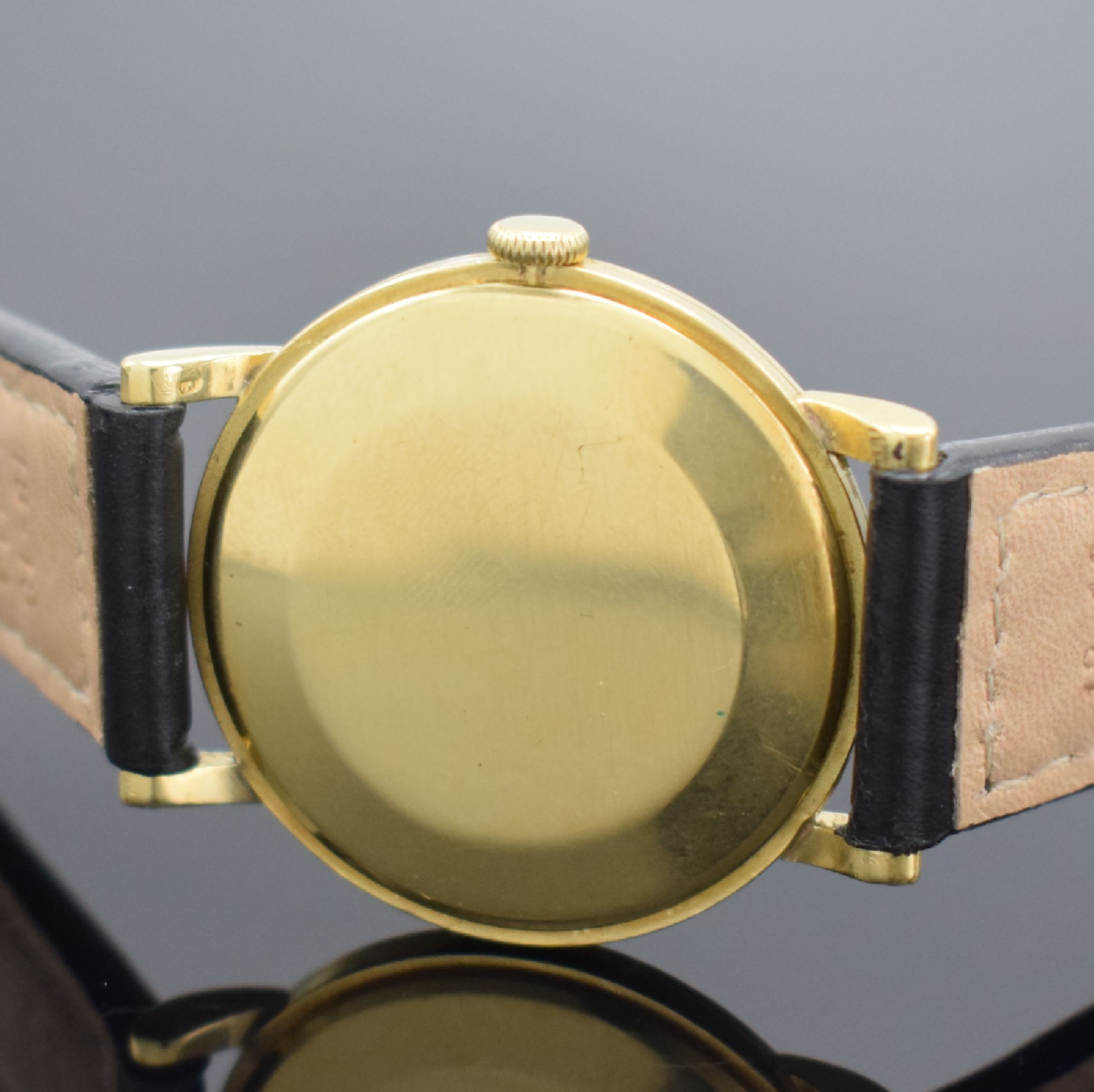 Detail c: IWC / BEYER Armbanduhr in GG 750/000, Schweiz um 1952, Handaufzug, Boden & Glasrand aufgedr., silb. Zifferbl. m. Verkäufersignatur Beyer ...
