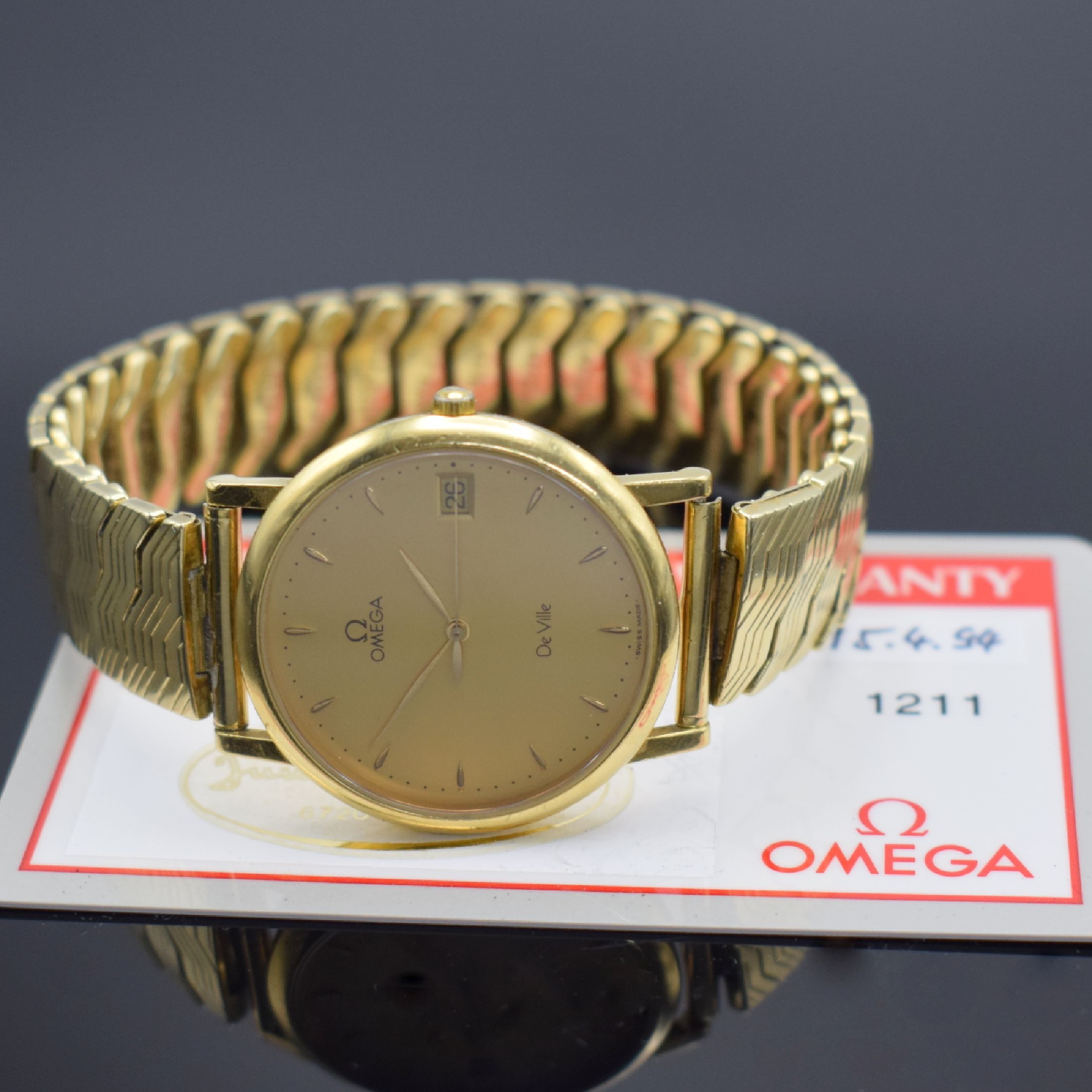 Detail d: OMEGA De Ville Herrenarmbanduhr in GG 750/000, Schweiz verk. lt. beil. Garantiekarte 04/1994, quarz, Boden aufgedr., neutr. Flexband in GG 585/000, ...