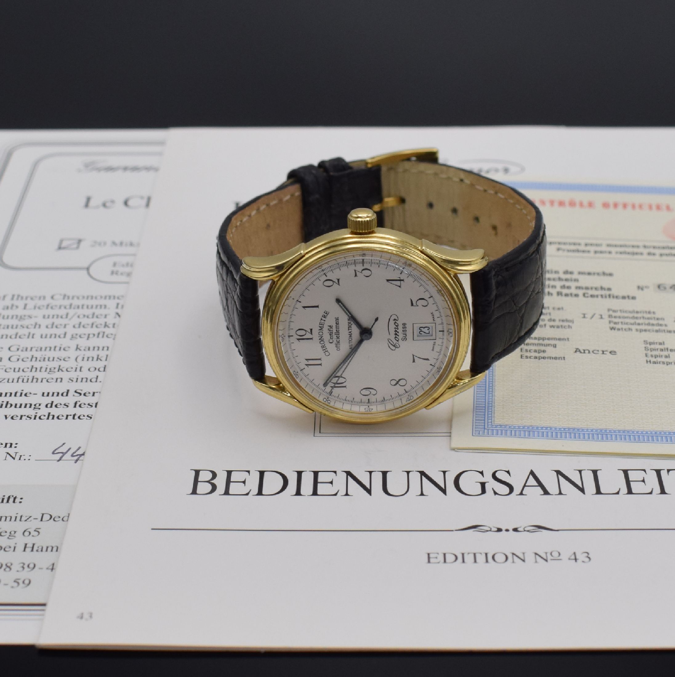 Detail e: COMOR Chronometre limitierte Herrenarmbanduhr in GG 750/000, Schweiz lt. orig. Papier verk. 1997, Automatik, beids. vergl. Geh., Boden verschr., ...